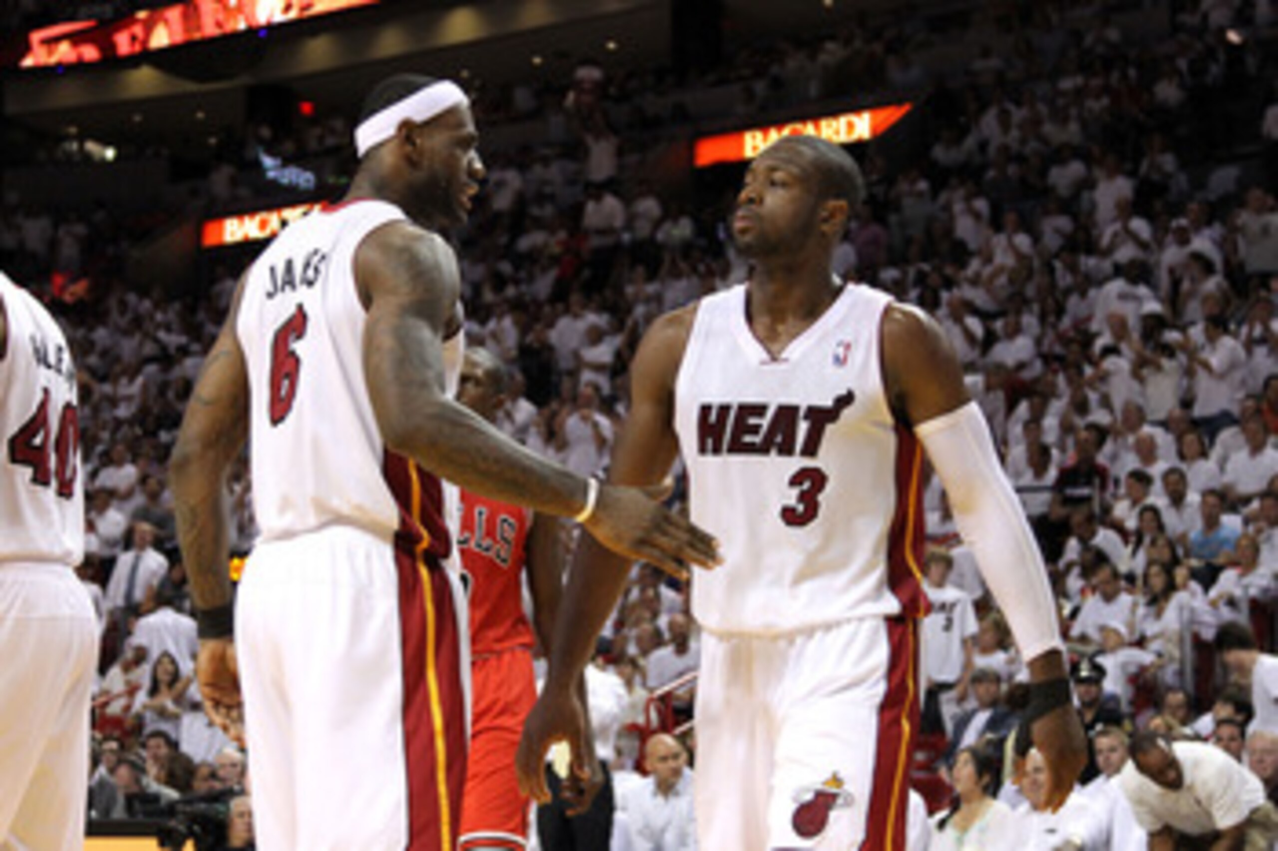 MIAMI, FL - MAY 24:  LeBron James #6 and Dwyane Wade #3 of the Miami Heat react against the Chicago Bulls in Game Four of the Eastern Conference Finals during the 2011 NBA Playoffs on May 24, 2011 at American Airlines Arena in Miami, Florida. The Heat won