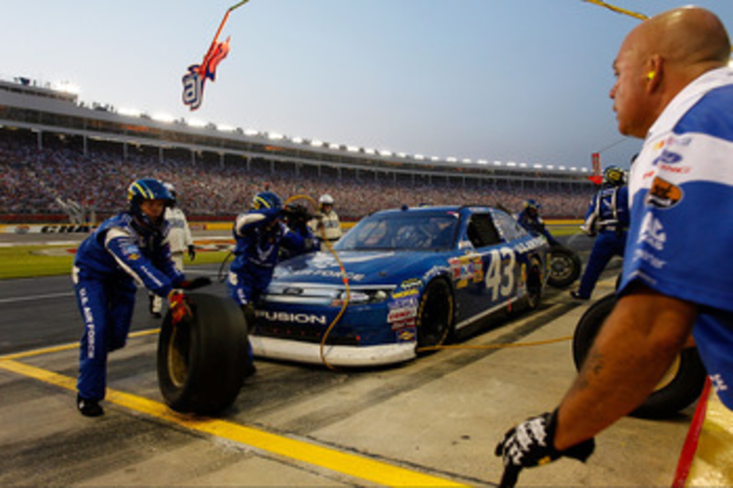 CONCORD, NC - MAY 29: AJ Allmendinger, driver of the #43 U.S. Air Force Ford, pits during the NASCAR Sprint Cup Series Coca-Cola 600 at Charlotte Motor Speedway on May 29, 2011 in Concord, North Carolina.  (Photo by Geoff Burke/Getty Images for NASCAR)