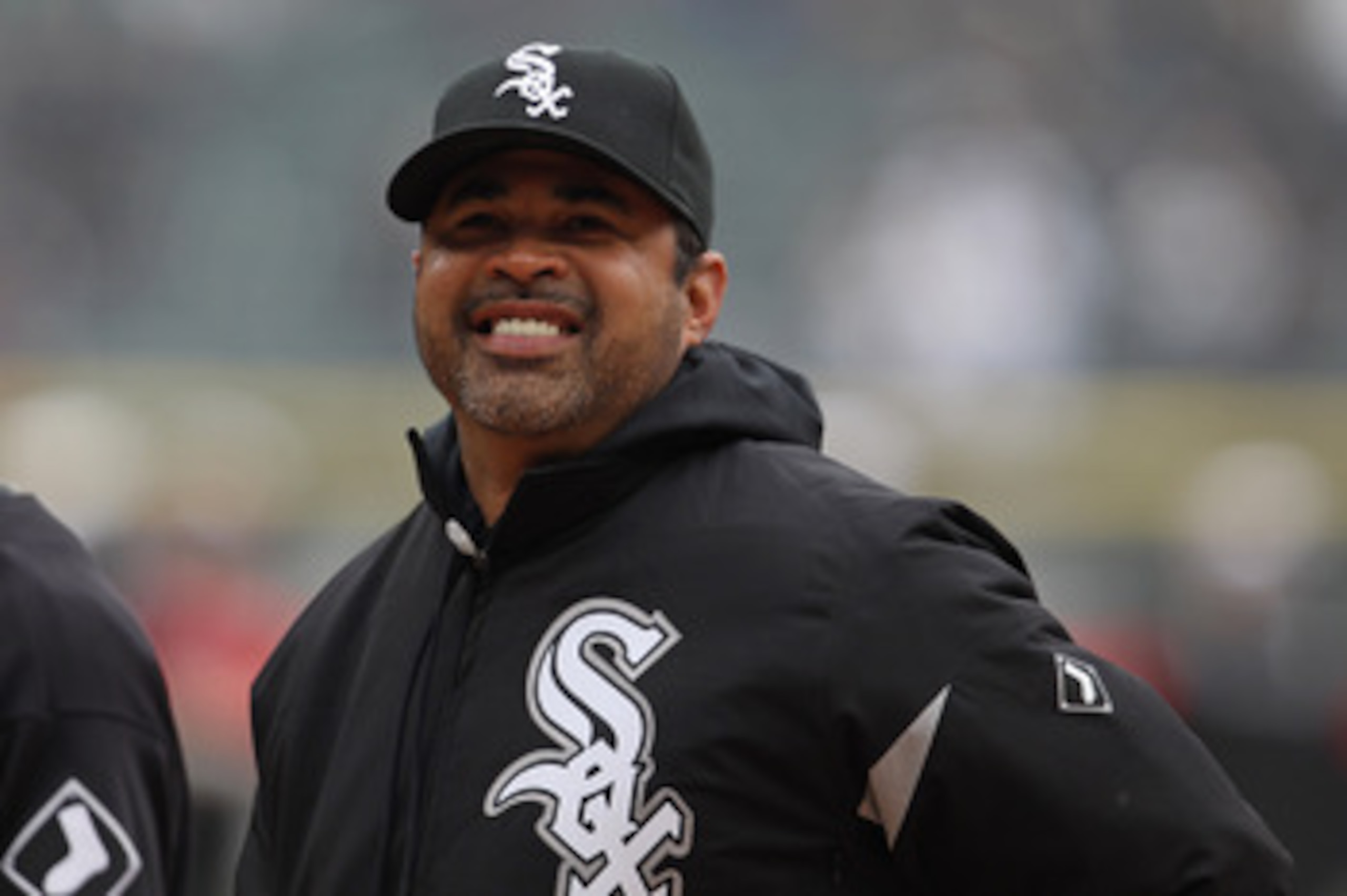 CHICAGO, IL - APRIL 07: Manager Ozzie Guillen #13 of the Chicago White Sox smiles at fans before the home opener against the Tampa Bay Rays at U.S. Cellular Field on April 7, 2011 in Chicago, Illinois. The White Sox defeated the Rays 5-1. (Photo by Jonath