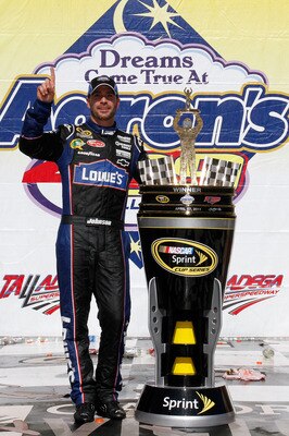 TALLADEGA, AL - APRIL 17:  Jimmie Johnson, driver of the #48 Lowe's Chevrolet, poses in Victory Lane after winning the NASCAR Sprint Cup Series Aaron's 499 at Talladega Superspeedway on April 17, 2011 in Talladega, Alabama.  (Photo by Jason Smith/Getty Im
