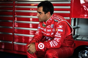 CHARLOTTE, NC - MAY 28:  Juan Pablo Montoya, driver of the #42 Target Chevrolet, sits in the garage during practice for the NASCAR Sprint Cup Series Coca-Cola 600 at Charlotte Motor Speedway on May 28, 2011 in Charlotte, North Carolina.  (Photo by Jason S