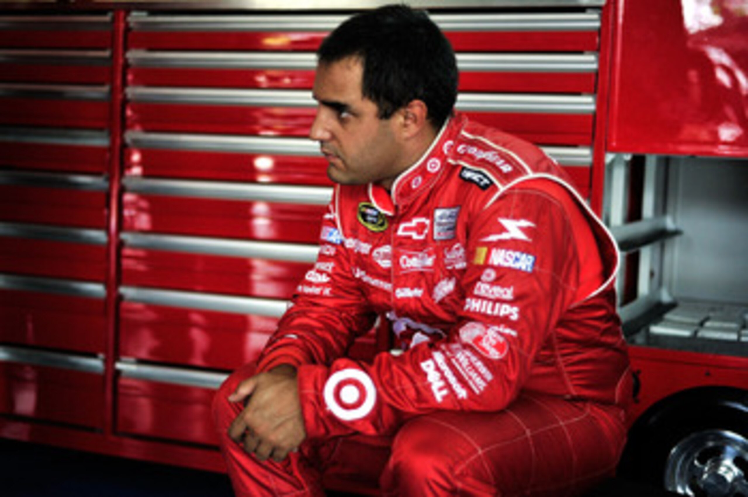 CHARLOTTE, NC - MAY 28:  Juan Pablo Montoya, driver of the #42 Target Chevrolet, sits in the garage during practice for the NASCAR Sprint Cup Series Coca-Cola 600 at Charlotte Motor Speedway on May 28, 2011 in Charlotte, North Carolina.  (Photo by Jason S