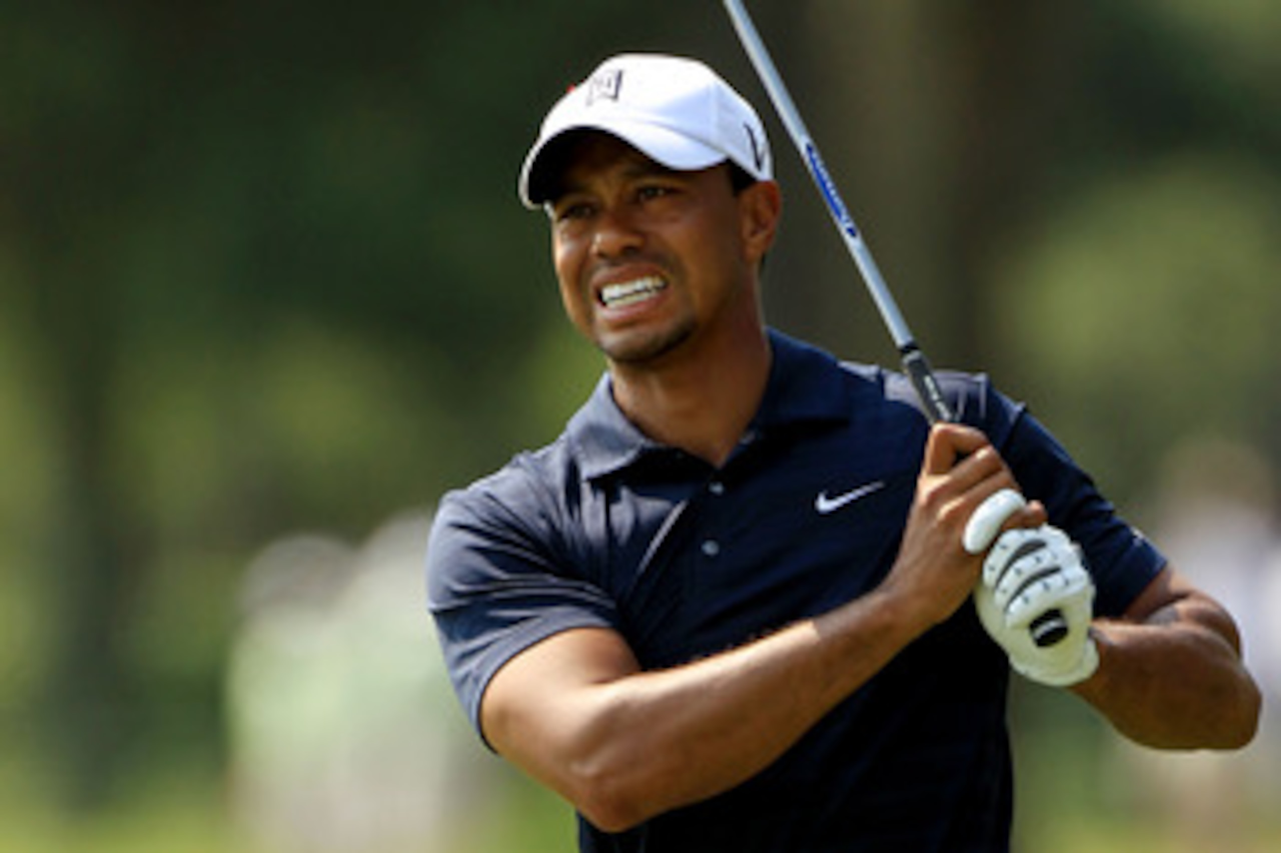 PONTE VEDRA BEACH, FL - MAY 12: Tiger Woods reacts to his approach shot on the ninth hole during the first round of THE PLAYERS Championship held at THE PLAYERS Stadium course at TPC Sawgrass on May 12, 2011 in Ponte Vedra Beach, Florida. Woods withdrew PONTE VEDRA BEACH, FL - MAY 12: Tiger Woods reacts to his approach shot on the ninth hole during the first round of THE PLAYERS Championship held at THE PLAYERS Stadium course at TPC Sawgrass on May 12, 2011 in Ponte Vedra Beach, Florida. Woods withdrew