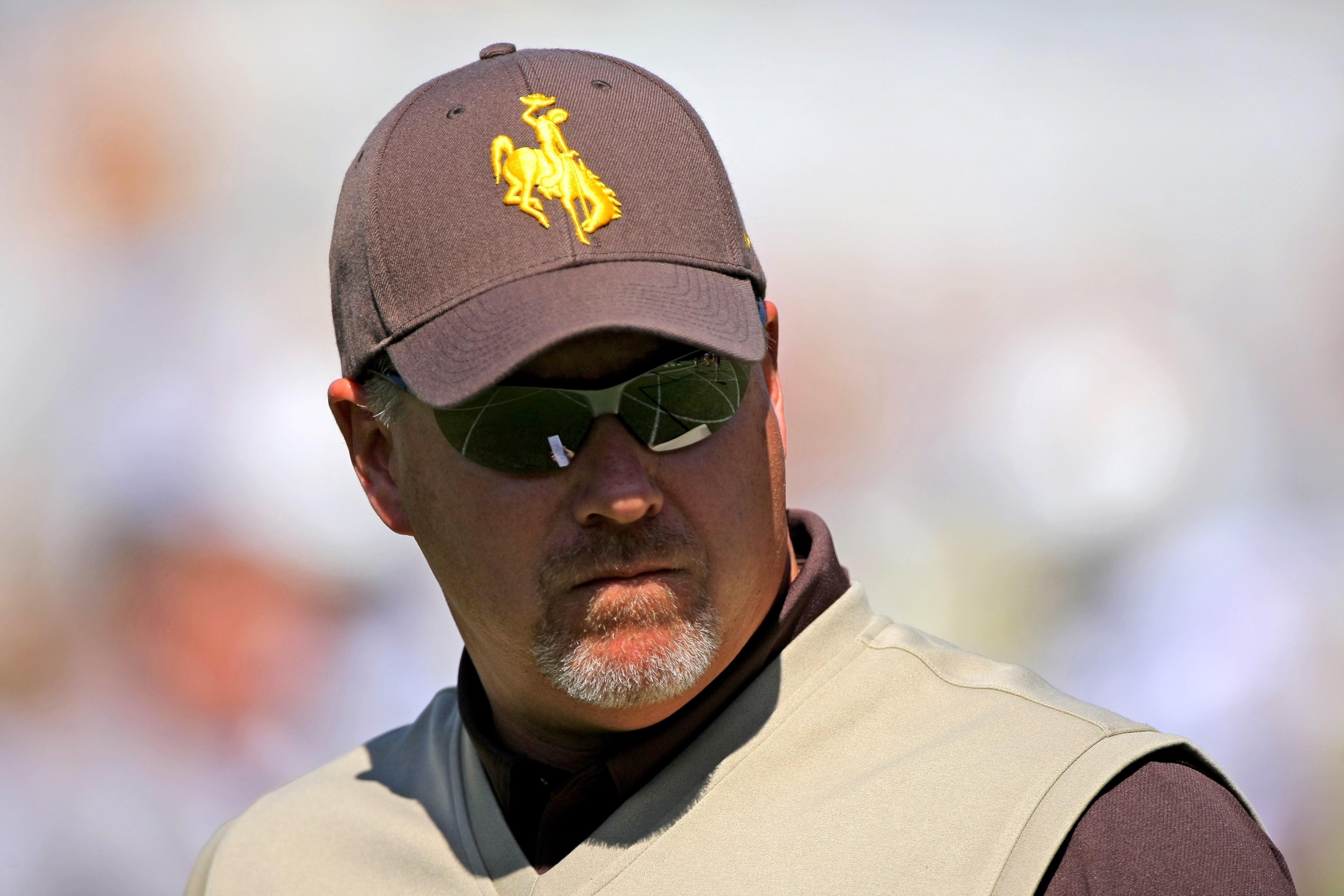 BOULDER, CO - SEPTEMBER 19:  Head coach Dave Christensen of the Wyoming Cowboys prepares to lead his team against the Colorado Buffaloes at Folsom Field on September 19, 2009 in Boulder, Colorado. The Buffaloes defeated the Cowboys 24-0.  (Photo by Doug P