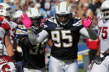 SAN DIEGO - OCTOBER 03: Linebackers Shaun Phillips #95 and Kevin Burnett #99 of the San Diego Chargers celebrate a Phillips sack against the Arizona Cardinals at Qualcomm Stadium on October 3, 2010 in San Diego, California. The Chargers won 41-10. (Ph SAN DIEGO - OCTOBER 03: Linebackers Shaun Phillips #95 and Kevin Burnett #99 of the San Diego Chargers celebrate a Phillips sack against the Arizona Cardinals at Qualcomm Stadium on October 3, 2010 in San Diego, California. The Chargers won 41-10. (Ph