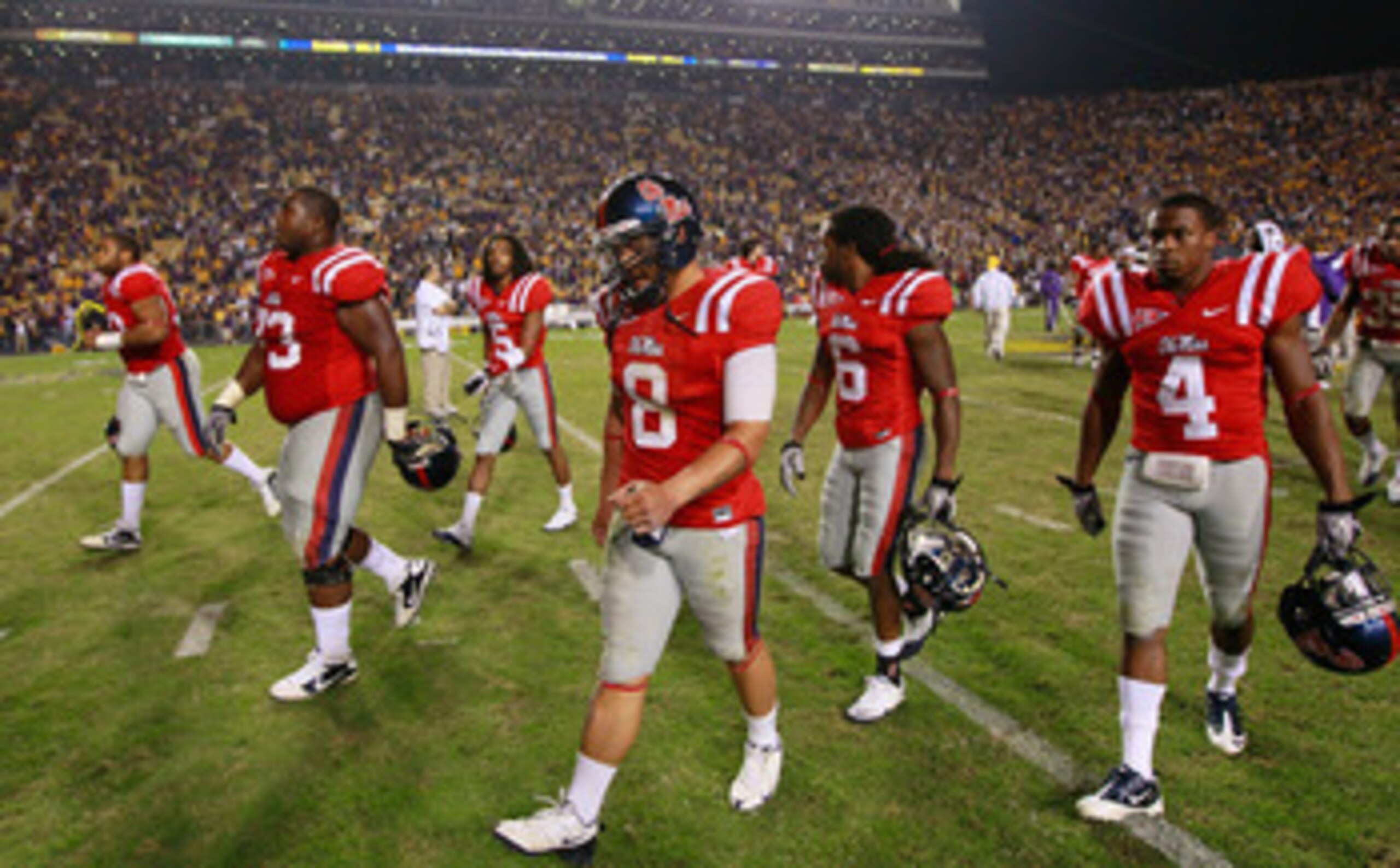 BATON ROUGE, LA - NOVEMBER 20:  Quarterback Jeremiah Masoli #8 of the Ole Miss Rebels walks off the field after their 43-36 loss to the Louisiana State University Tigers at Tiger Stadium on November 20, 2010 in Baton Rouge, Louisiana.  (Photo by Kevin C.