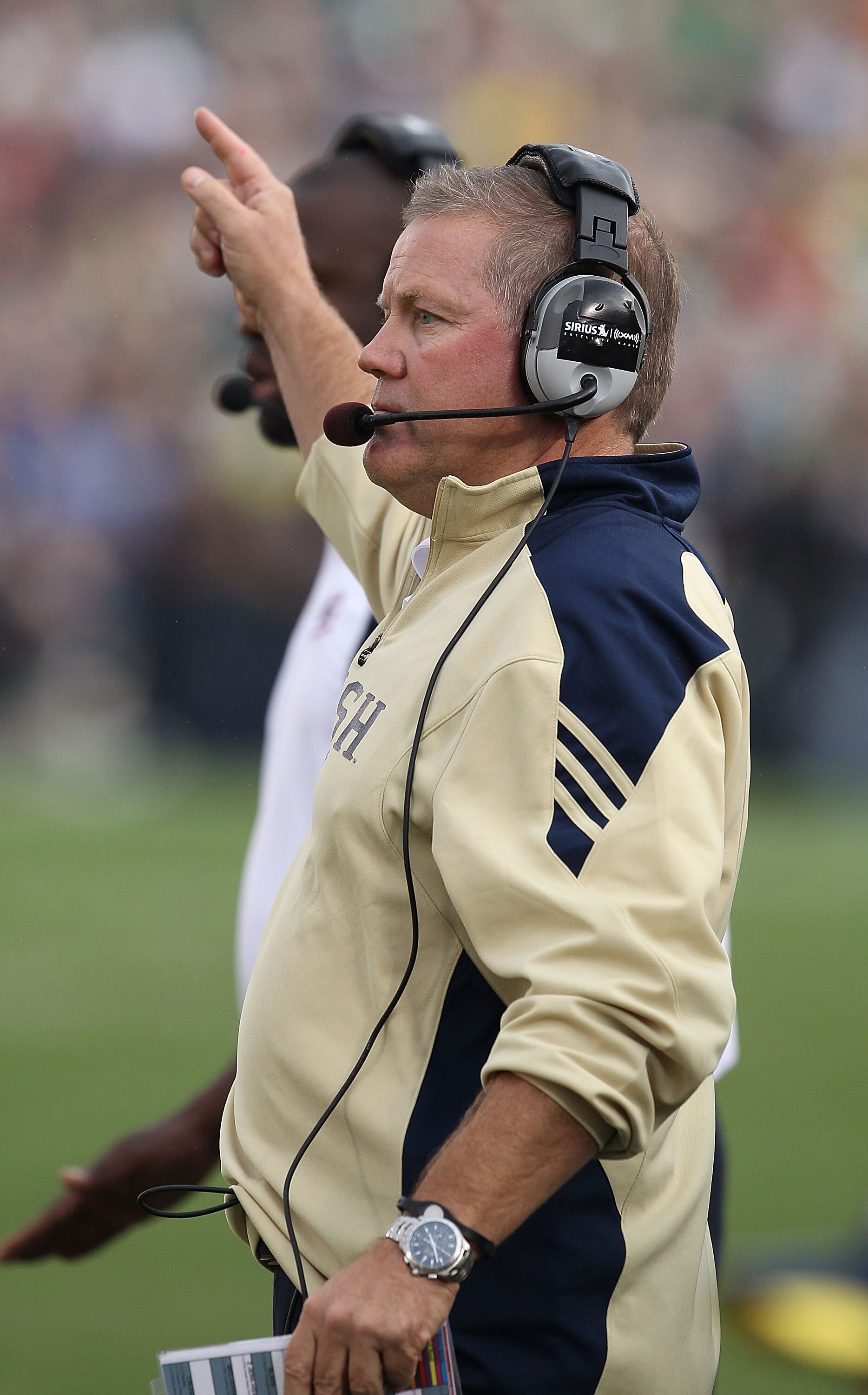 SOUTH BEND, IN - SEPTEMBER 11: Head coach Brian Kelly of the Notre Dame Fighting Irish watches as his team takes on the Michigan Wolverines at Notre Dame Stadium on September 11, 2010 in South Bend, Indiana. Michigan defeated Notre Dame 28-24.  (Photo by