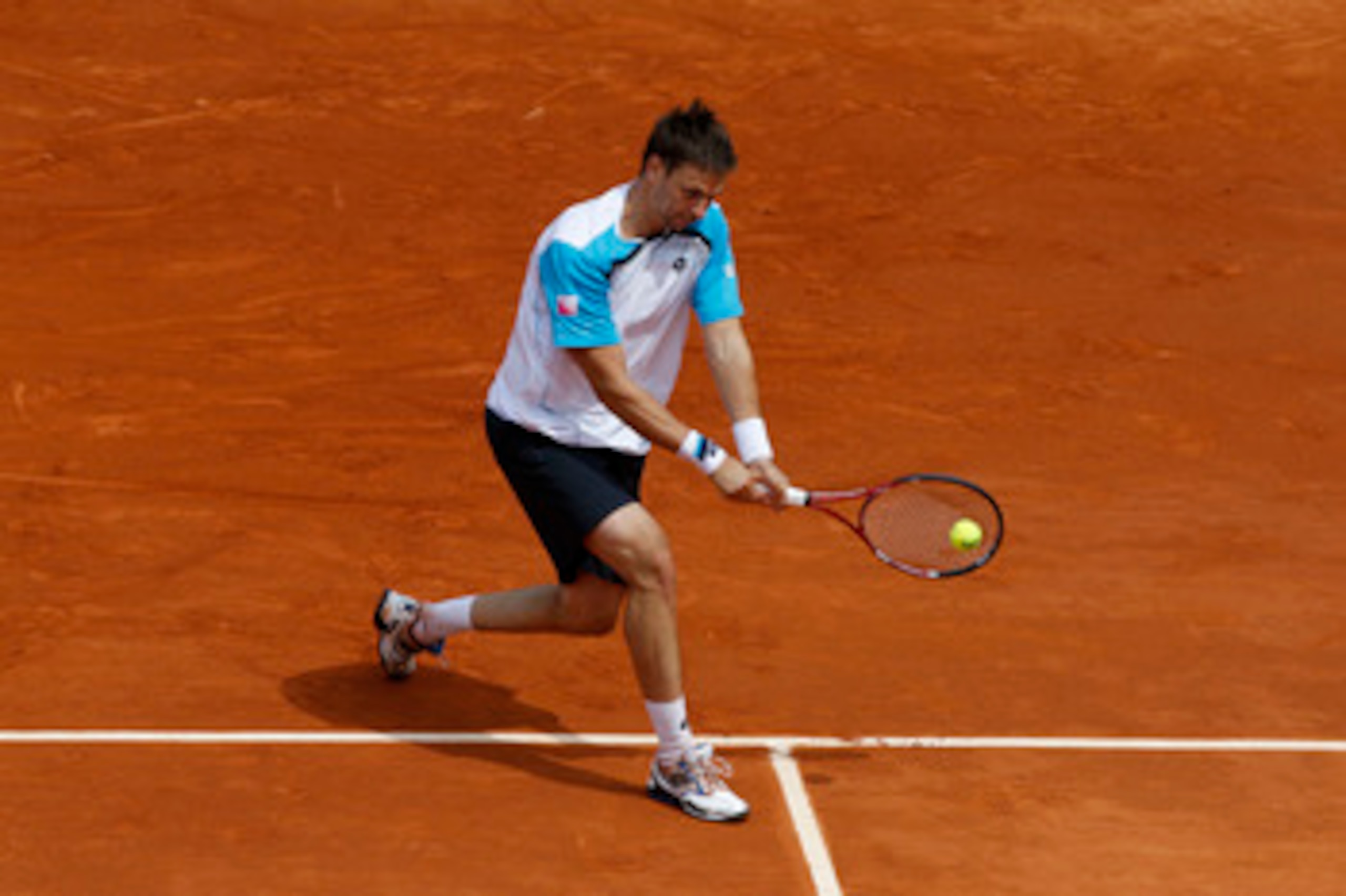 PARIS, FRANCE - MAY 26:  Robin Soderling of Sweden plays a backhand during the men's singles round two match between Albert Ramos of Spain and Robin Soderling of Sweden on day five of the French Open at Roland Garros on May 26, 2011 in Paris, France.  (Ph