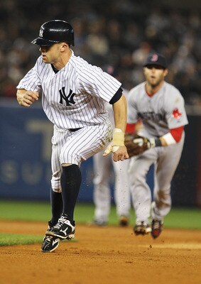NEW YORK, NY - MAY 15:  Brett Gardner #11 of the New York Yankees is caught in a run down against the Boston Red Sox during their game on May 15, 2011 at Yankee Stadium in the Bronx borough of New York City.  (Photo by Al Bello/Getty Images)