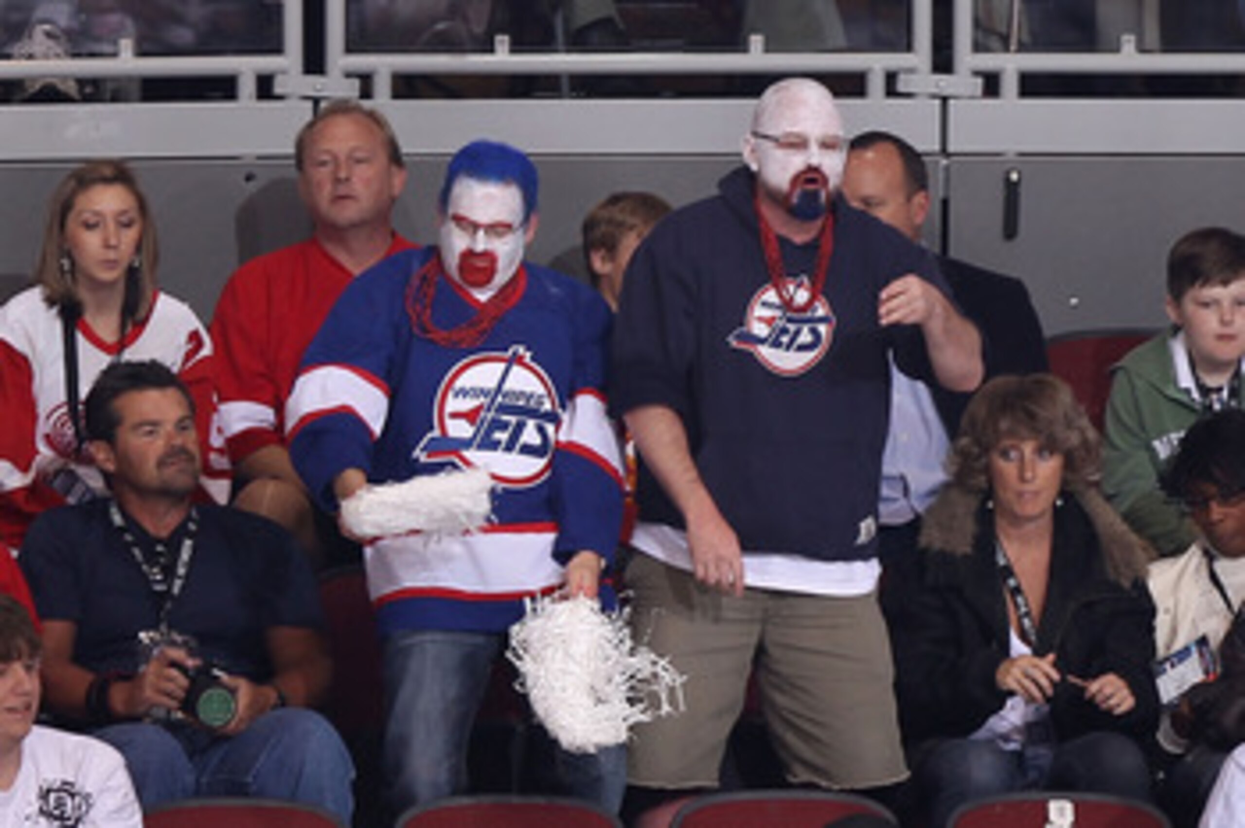 GLENDALE, AZ - APRIL 20: Fans dressed in Winnipeg Jets uniforms attend Game Four of the Western Conference Quarterfinals between the Detroit Red Wings and the Phoenix Coyotes during the 2011 NHL Stanley Cup Playoffs at Jobing.com Arena on April 20, 2011 GLENDALE, AZ - APRIL 20: Fans dressed in Winnipeg Jets uniforms attend Game Four of the Western Conference Quarterfinals between the Detroit Red Wings and the Phoenix Coyotes during the 2011 NHL Stanley Cup Playoffs at Jobing.com Arena on April 20, 2011