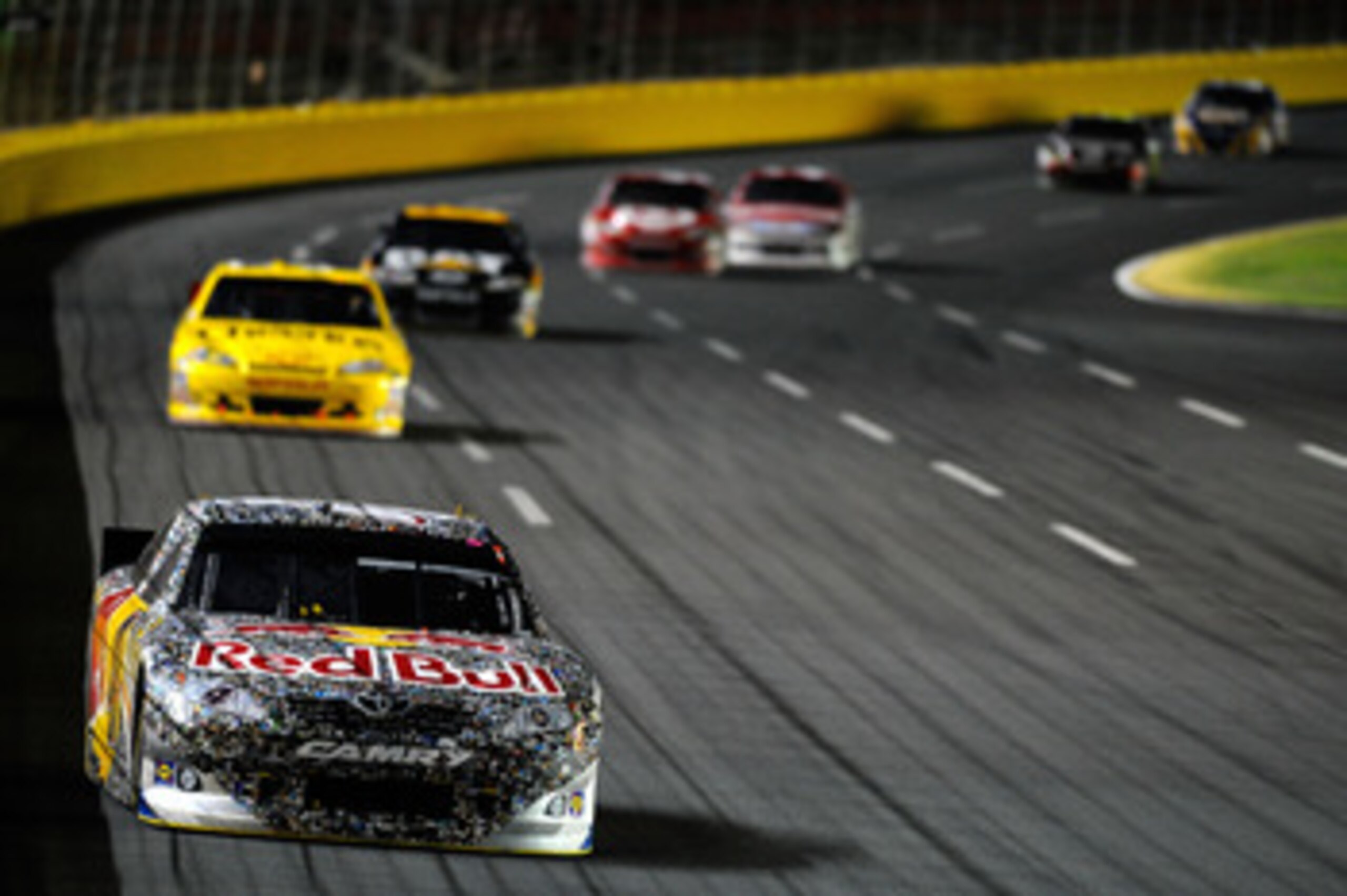 CONCORD, NC - MAY 29:  Kasey Kahne, driver of the #4 Red Bull Toyota, leads the field during the NASCAR Sprint Cup Series Coca-Cola 600 at Charlotte Motor Speedway on May 29, 2011 in Concord, North Carolina.  (Photo by Jared C. Tilton/Getty Images for NAS
