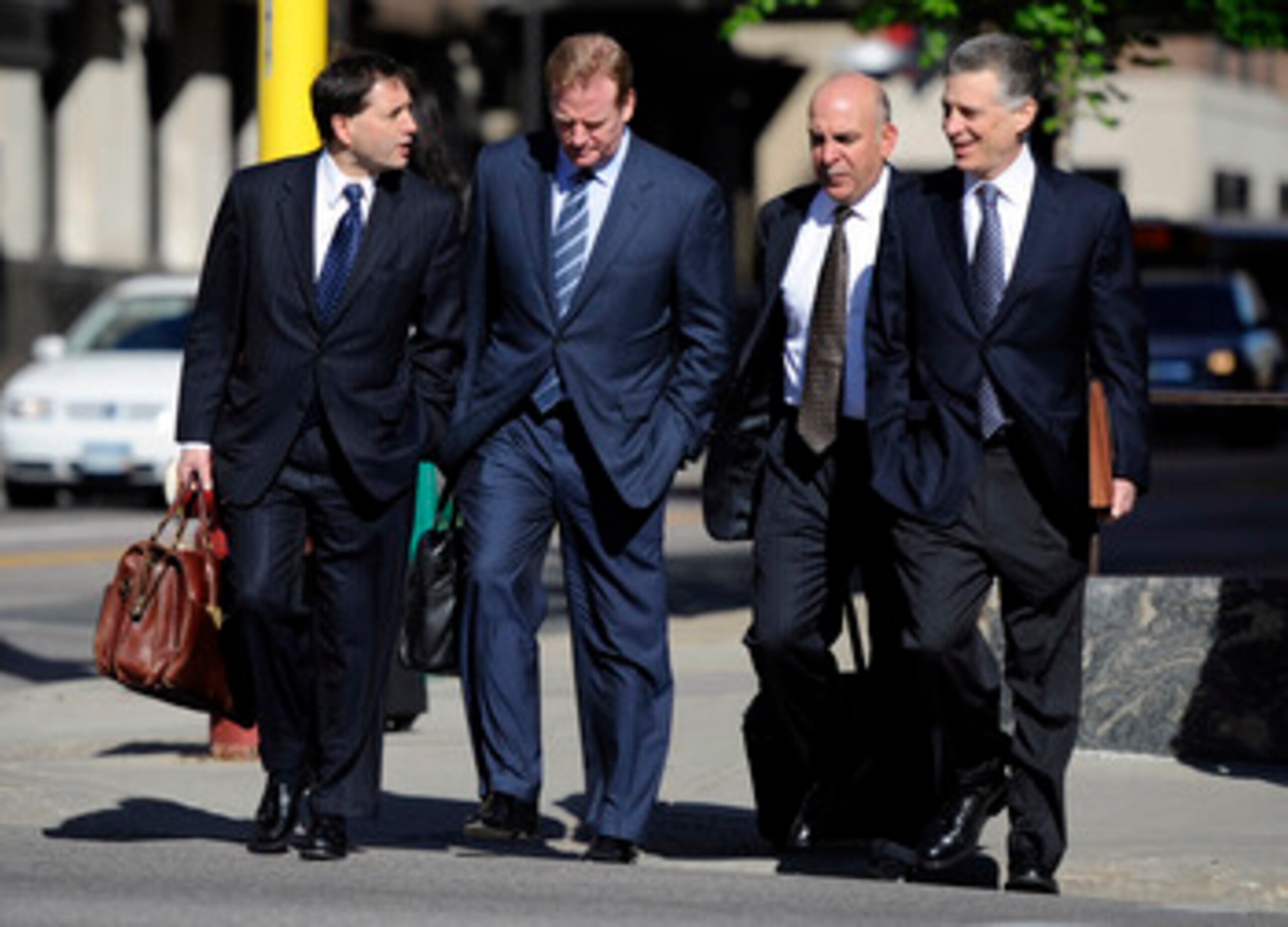 MINNEAPOLIS, MN - MAY 17: NFL lawyer Jeff Pash (L), NFL Commissioner Roger Goodell and Art Rooney II (R), president of the Pittsburgh Steelers arrive for court ordered mediation at the U.S. Courthouse on May 17, 2011 in Minneapolis, Minnesota. As the NFL MINNEAPOLIS, MN - MAY 17: NFL lawyer Jeff Pash (L), NFL Commissioner Roger Goodell and Art Rooney II (R), president of the Pittsburgh Steelers arrive for court ordered mediation at the U.S. Courthouse on May 17, 2011 in Minneapolis, Minnesota. As the NFL