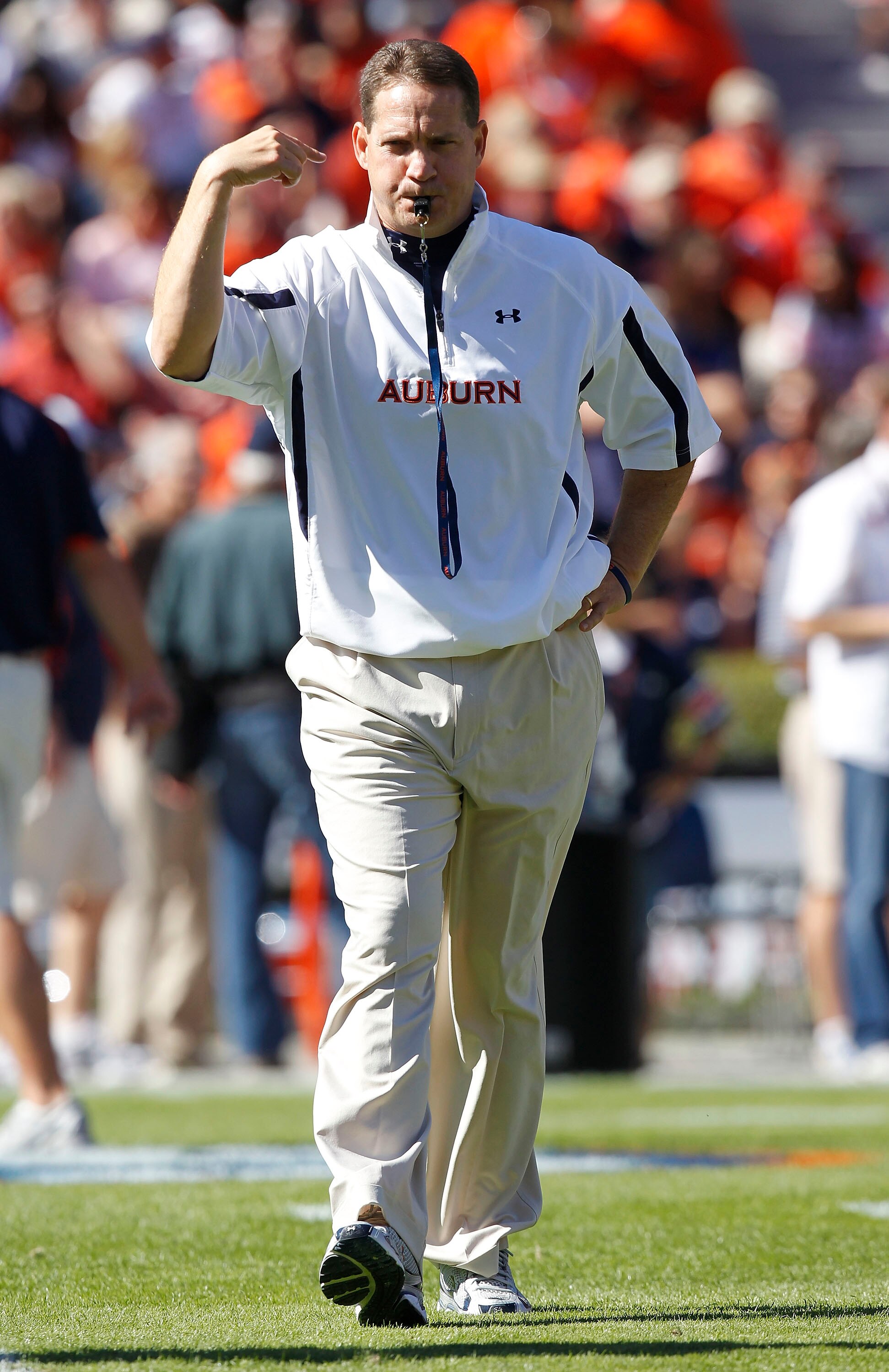 AUBURN - OCTOBER 16:  Auburn head coach Gene Chizik blows his whistle during warm ups before the game against the Arkansas Razorbacks at Jordan-Hare Stadium on October 16, 2010 in Auburn, Alabama.  (Photo by Mike Zarrilli/Getty Images)