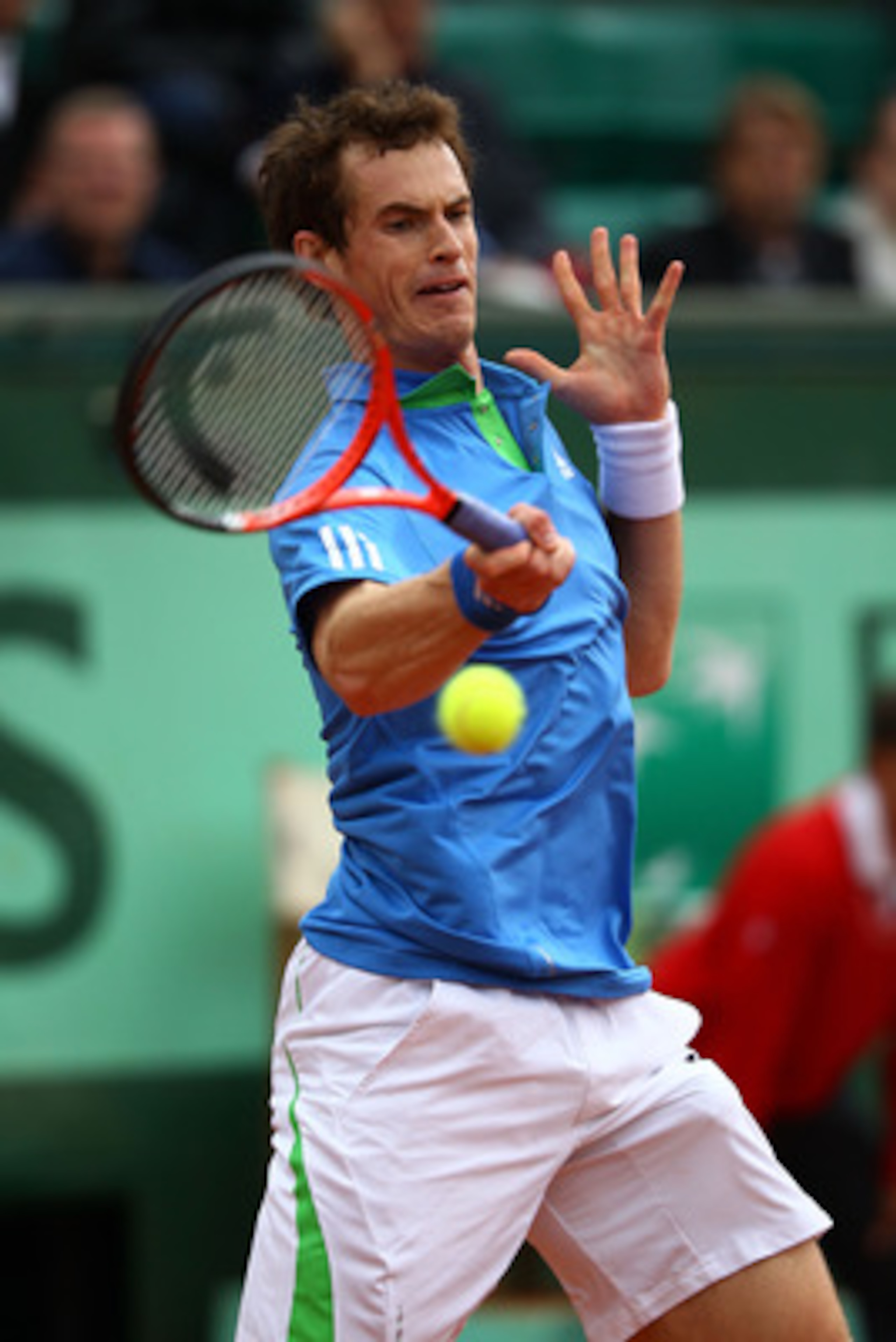 PARIS, FRANCE - MAY 31:  Andy Murray of Great Britain hits a forehand during the men's singles round four match between Andy Murray of Great Britain and Viktor Troicki of Serbia on day ten of the French Open at Roland Garros on May 31, 2011 in Paris, Fran