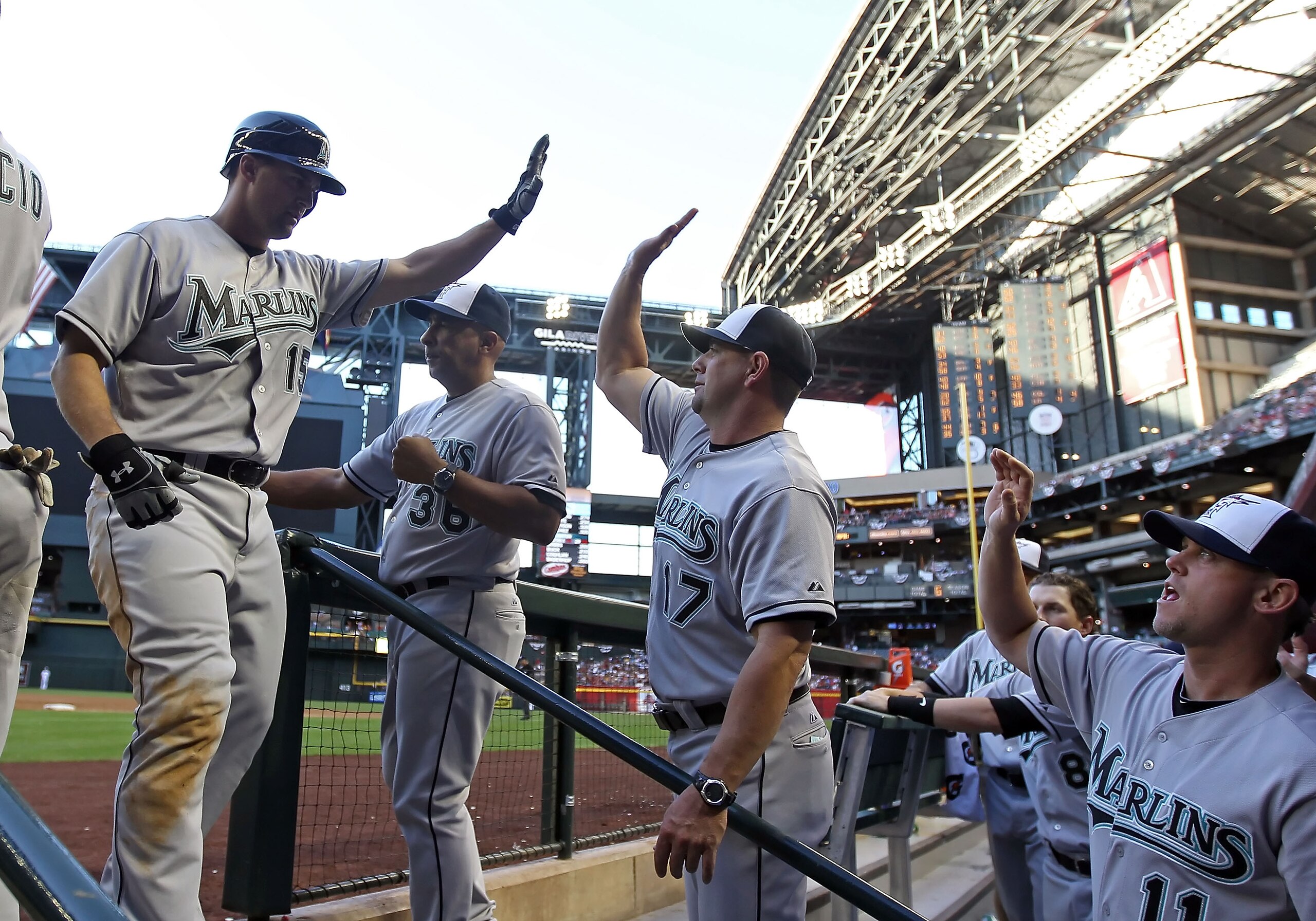 PHOENIX, AZ - MAY 30: Gaby Sanchez #15 of the Florida Marlins high fives coach Brandon Hyde #17 after hitting a two run home run against the Arizona Diamondbacks during the fifth inning of the Major League Baseball game at Chase Field on May 30, 2011 in PHOENIX, AZ - MAY 30: Gaby Sanchez #15 of the Florida Marlins high fives coach Brandon Hyde #17 after hitting a two run home run against the Arizona Diamondbacks during the fifth inning of the Major League Baseball game at Chase Field on May 30, 2011 in