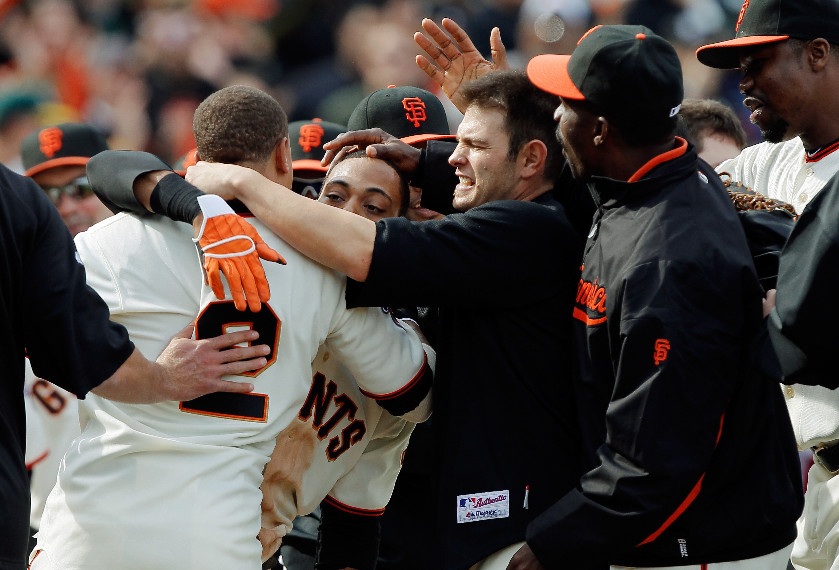 SAN FRANCISCO, CA - MAY 22: Darren Ford #34 of the San Francisco Giants gets mobbed after scoring the winning run on a single by Emmanuel Burriss #2 against the Oakland A's in the 11th inning at AT&T Park on May 22, 2011 in San Francisco, California. The