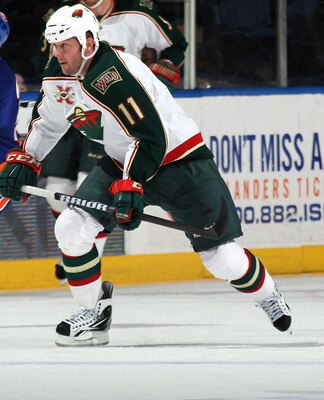 UNIONDALE, NY - MARCH 02:  John Madden #11 of the Minnesota Wild skates against the New York Islanders at the Nassau Coliseum on March 2, 2011 in Uniondale, New York. The Islanders defeated the Wild 4-1.  (Photo by Bruce Bennett/Getty Images)