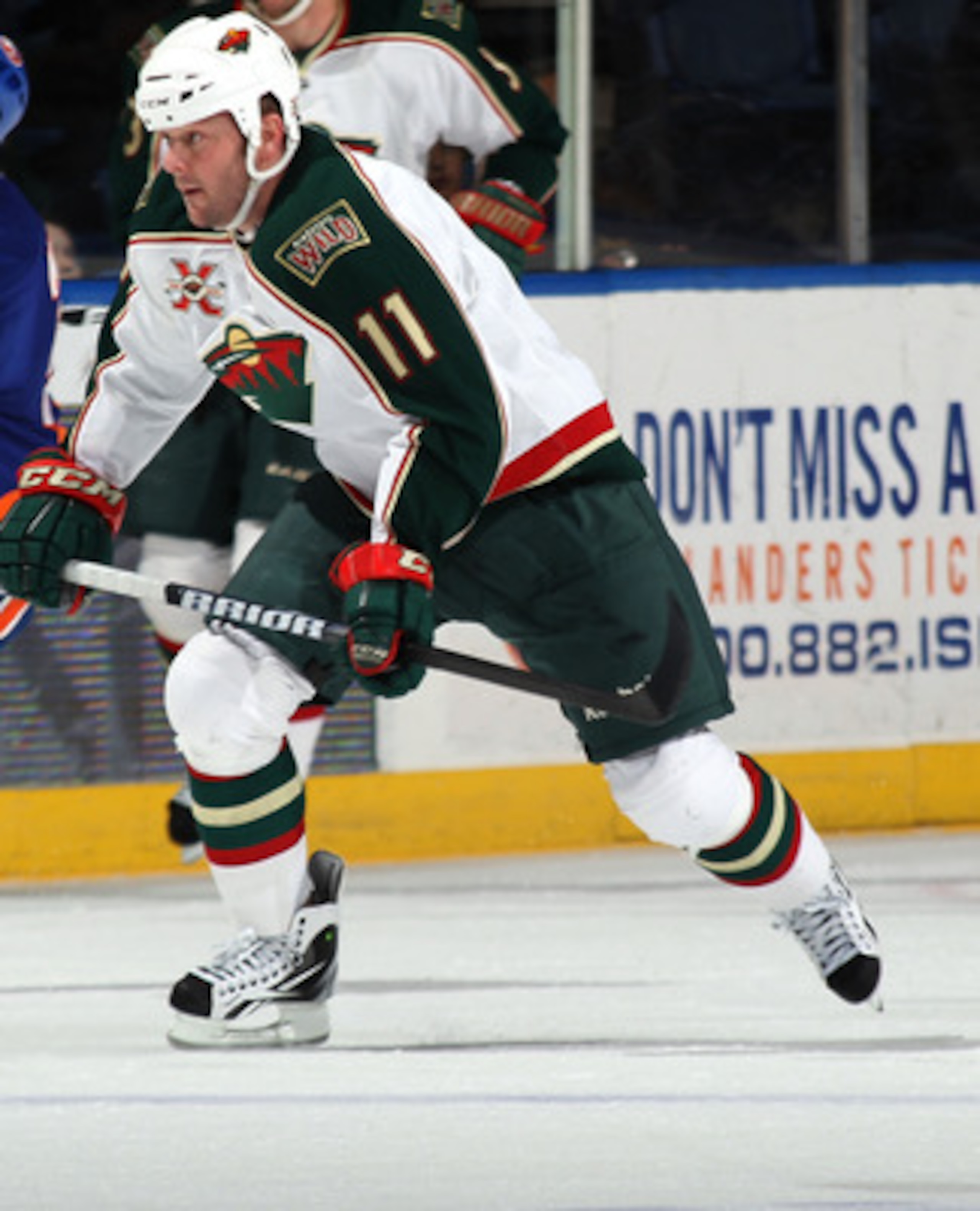 UNIONDALE, NY - MARCH 02:  John Madden #11 of the Minnesota Wild skates against the New York Islanders at the Nassau Coliseum on March 2, 2011 in Uniondale, New York. The Islanders defeated the Wild 4-1.  (Photo by Bruce Bennett/Getty Images)