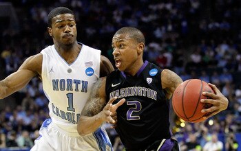 CHARLOTTE, NC - MARCH 20:  Isaiah Thomas #2 of the Washington Huskies drives on Dexter Strickland #1 of the North Carolina Tar Heels during the third round of the 2011 NCAA men's basketball tournament at Time Warner Cable Arena on March 20, 2011 in Charlo