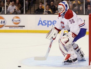 BOSTON, MA - MARCH 24:  Alex Auld #35 of the Montreal Canadiens stops a shot in the third period by the Boston Bruins on March 24, 2011 at the TD Garden in Boston, Massachusetts.  The Boston Bruins defeated the Montreal Canadiens 7-0.  (Photo by Elsa/Gett