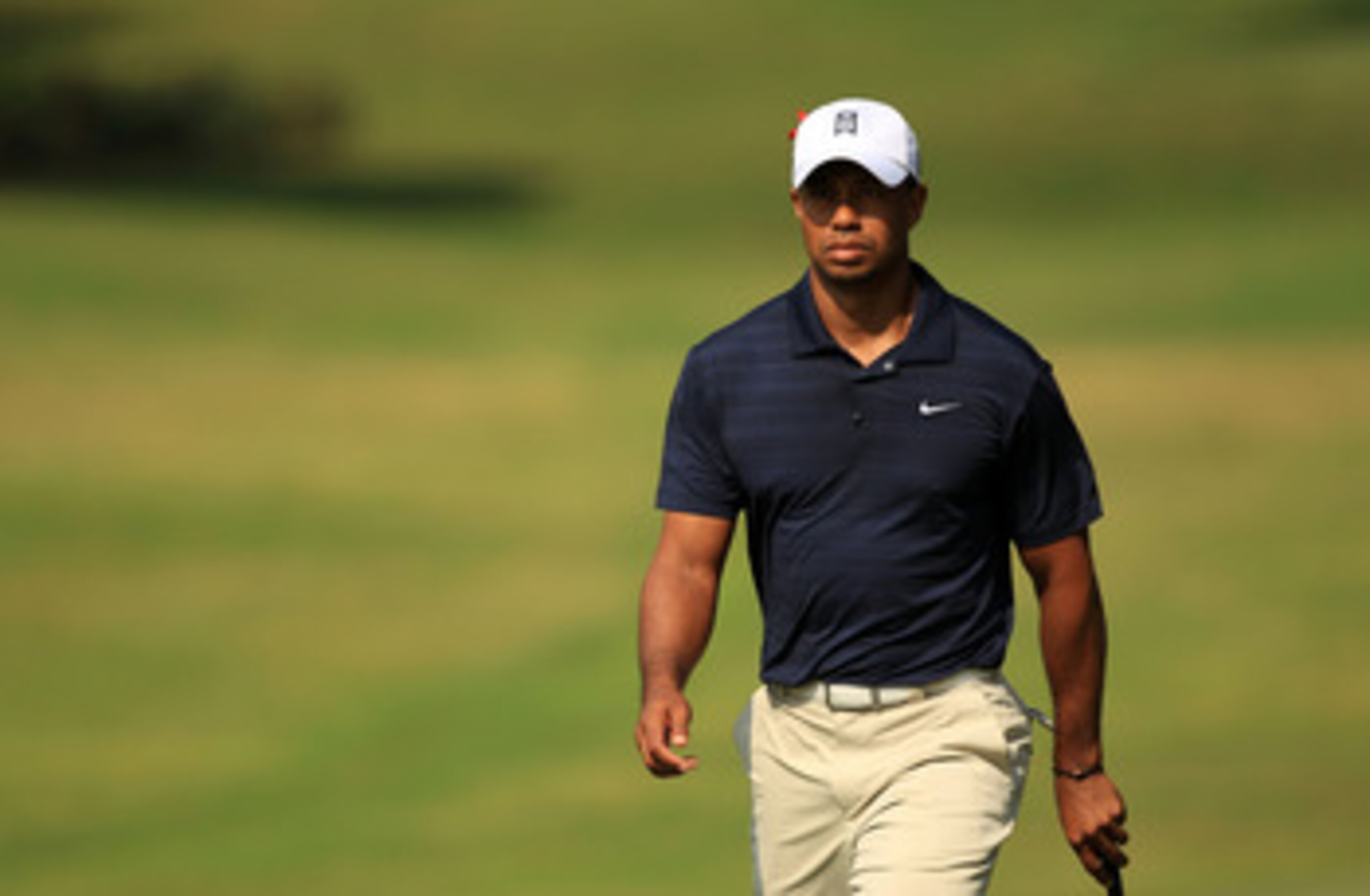 PONTE VEDRA BEACH, FL - MAY 12:  Tiger Woods walks up the eighth hole during the first round of THE PLAYERS Championship held at THE PLAYERS Stadium course at TPC Sawgrass on May 12, 2011 in Ponte Vedra Beach, Florida.  (Photo by Streeter Lecka/Getty Imag
