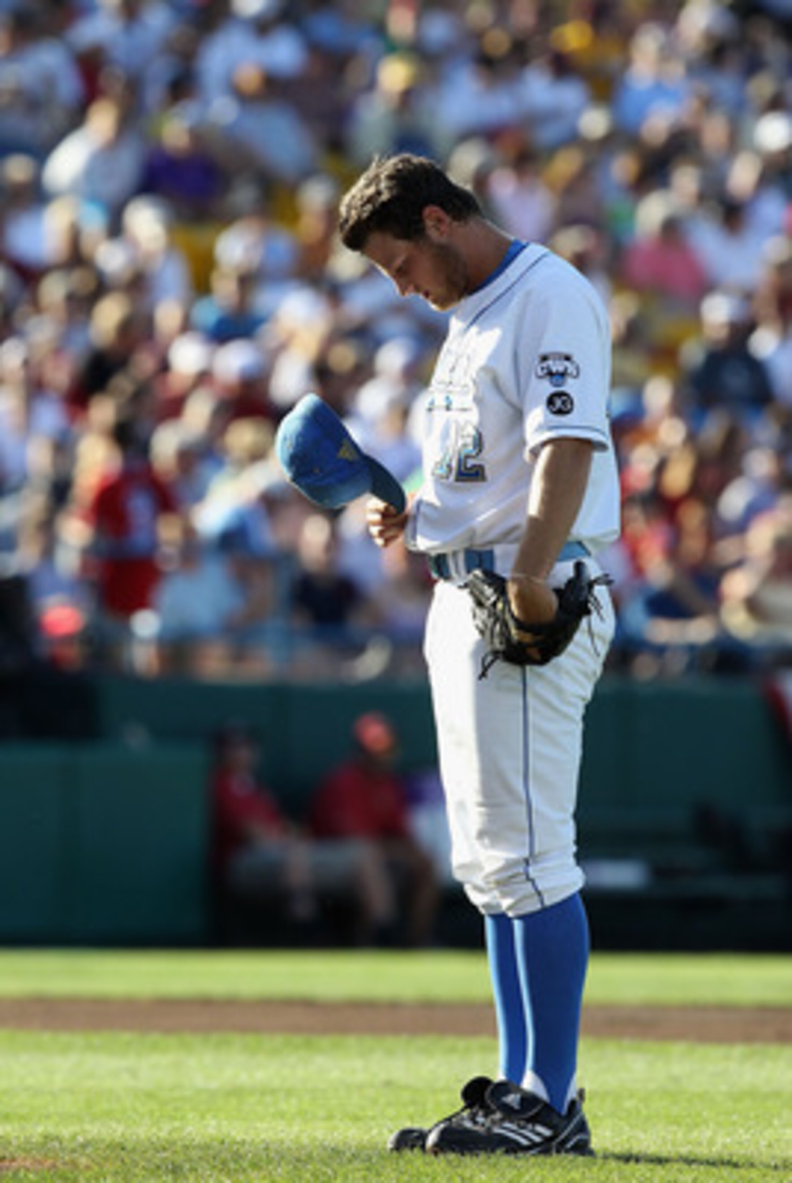 OMAHA, NE - JUNE 28:  Starting pitcher Gerrit Cole #12 of the UCLA Bruins prepares himself before pitching against the South Carolina Gamecocks during Game 1 of the men's 2010 NCAA College Baseball World Series at Rosenblatt Stadium on June 28, 2010 in Om