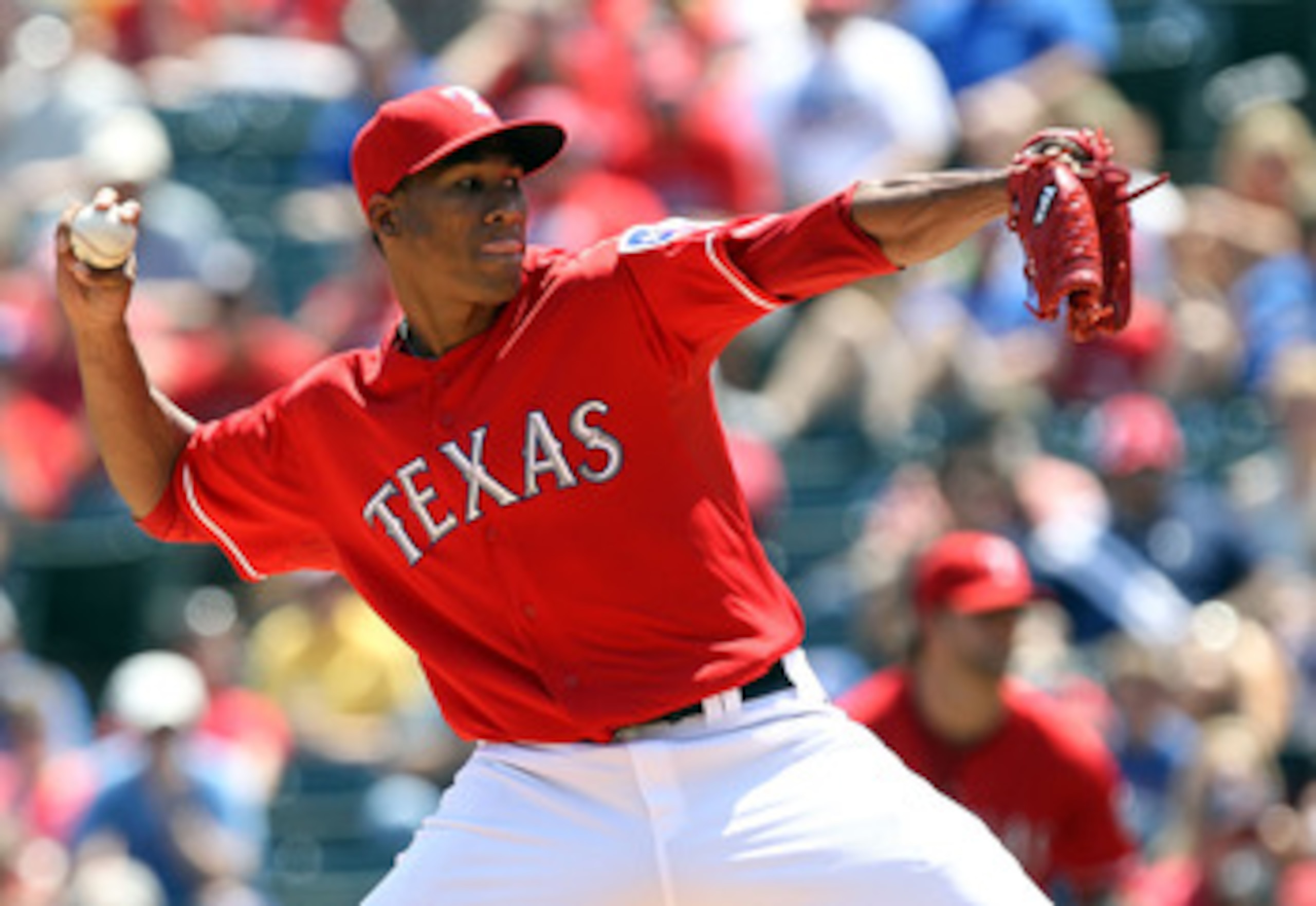ARLINGTON, TX - MAY 29:  Alexi Ogando #41 of the Texas Rangers throws against the Kansas City Royals at Rangers Ballpark in Arlington on May 29, 2011 in Arlington, Texas.  (Photo by Ronald Martinez/Getty Images)