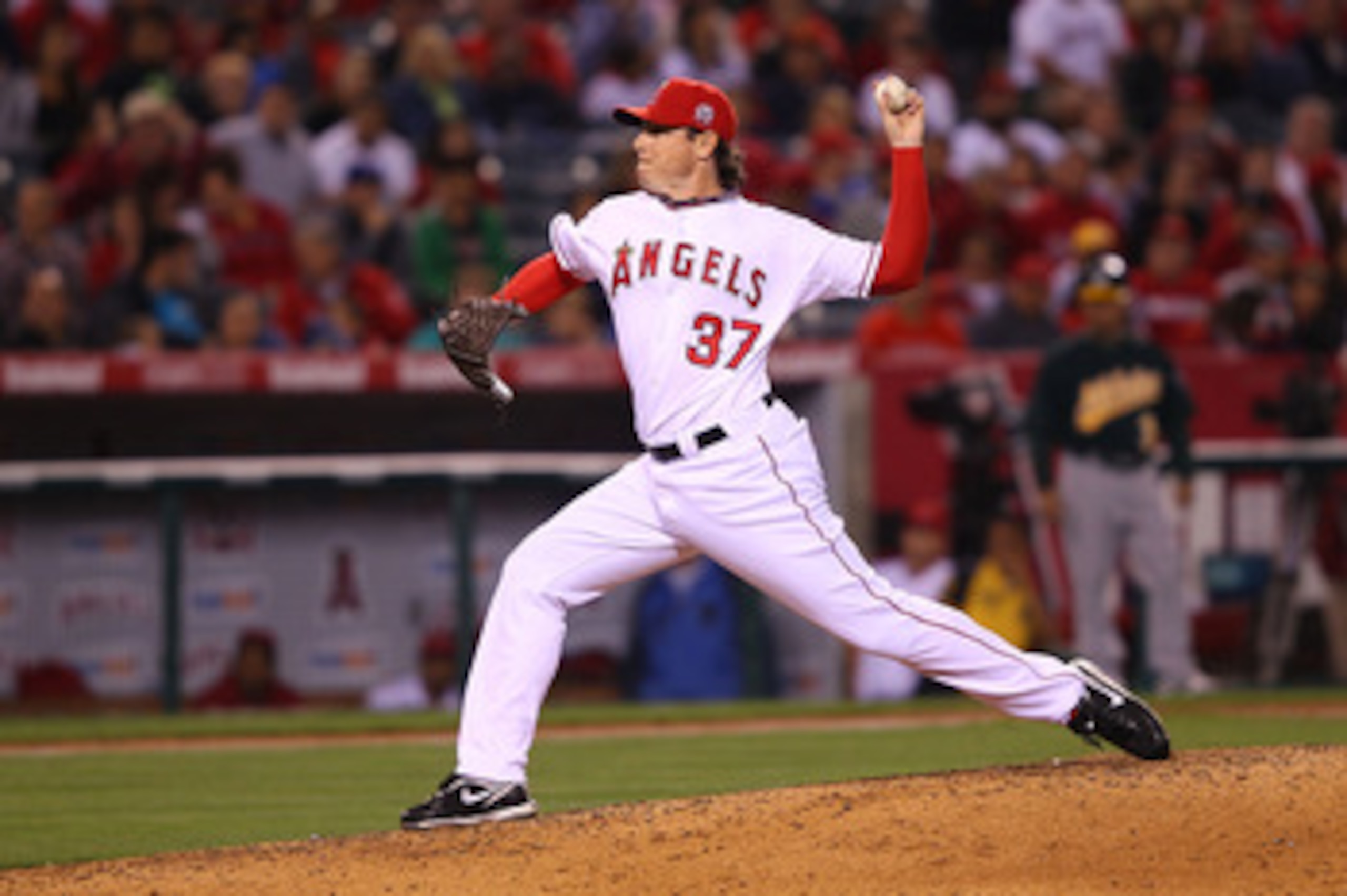 ANAHEIM, CA - MAY 23:  Scott Downs #37 of the Los Angeles Angeles of Anaheim pitches in the eighth inning during the game against the Oakland Athletics at Angel Stadium on May 23, 2011 in Anaheim, California.  (Photo by Joe Scarnici/Getty Images)