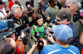 INDIANAPOLIS - MAY 22: Danica Patrick driver of the #7 Team GoDaddy Andretti Autosport Dallara Honda talks with the media after qualifying for the the 95th Indianapolis 500 Mile Race at the Indianapolis Motor Speedway on May 22, 2011 in Indianapolis, Indi