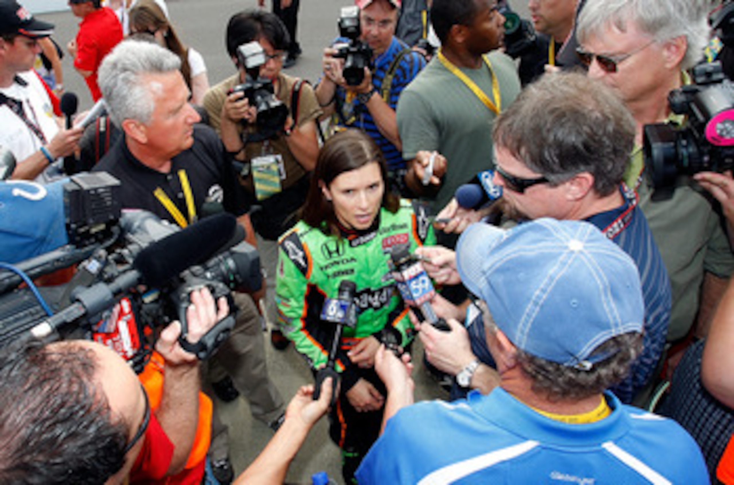 INDIANAPOLIS - MAY 22: Danica Patrick driver of the #7 Team GoDaddy Andretti Autosport Dallara Honda talks with the media after qualifying for the the 95th Indianapolis 500 Mile Race at the Indianapolis Motor Speedway on May 22, 2011 in Indianapolis, Indi