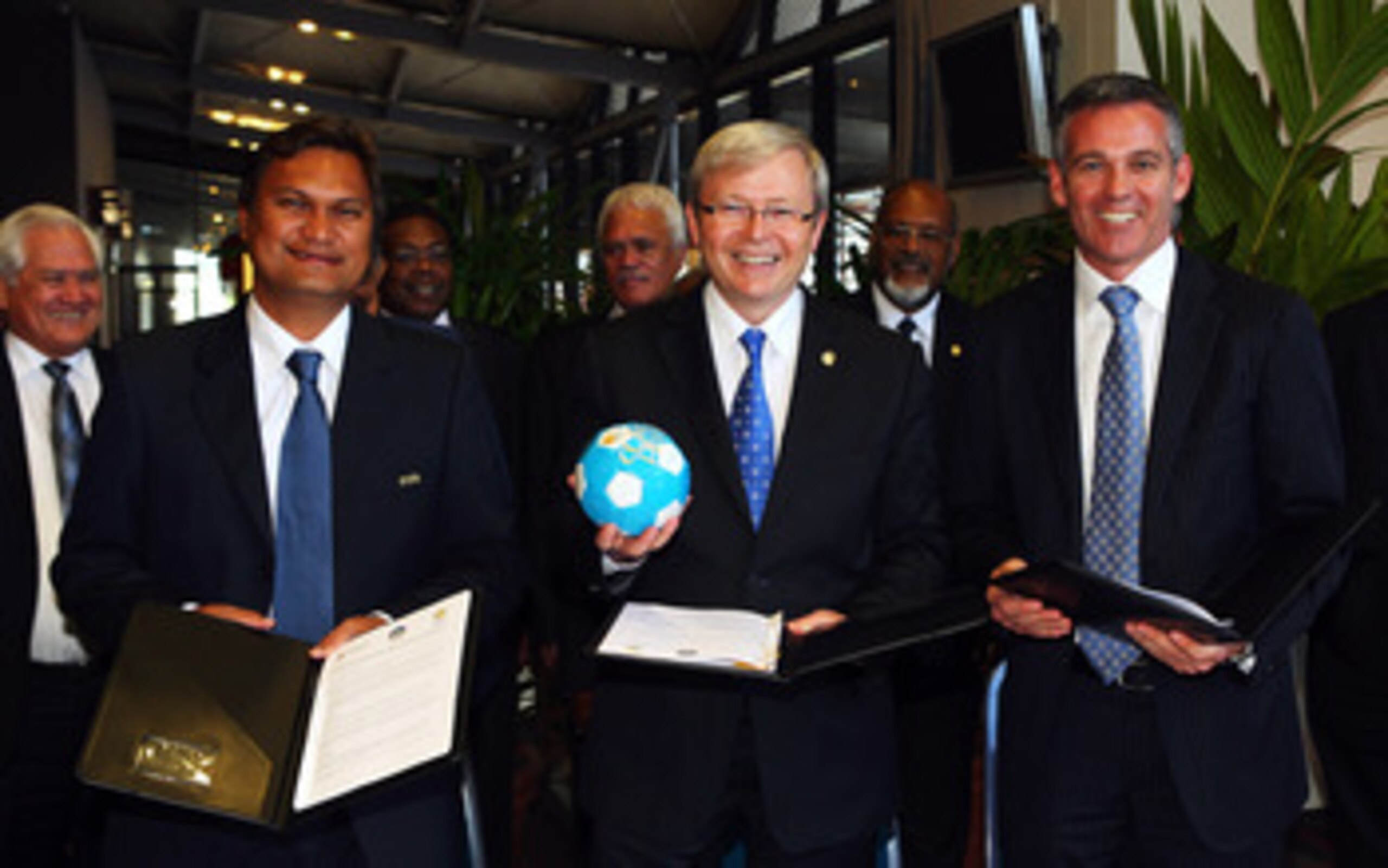CAIRNS, AUSTRALIA - AUGUST 05:  (L-R) President of the Oceania Football Confederation Reynald Temarii, Australian Prime Minister Kevin Rudd and CEO of Football Australia Ben Buckley pose after signing a joint agreement at the Pacific Island Leaders Forum