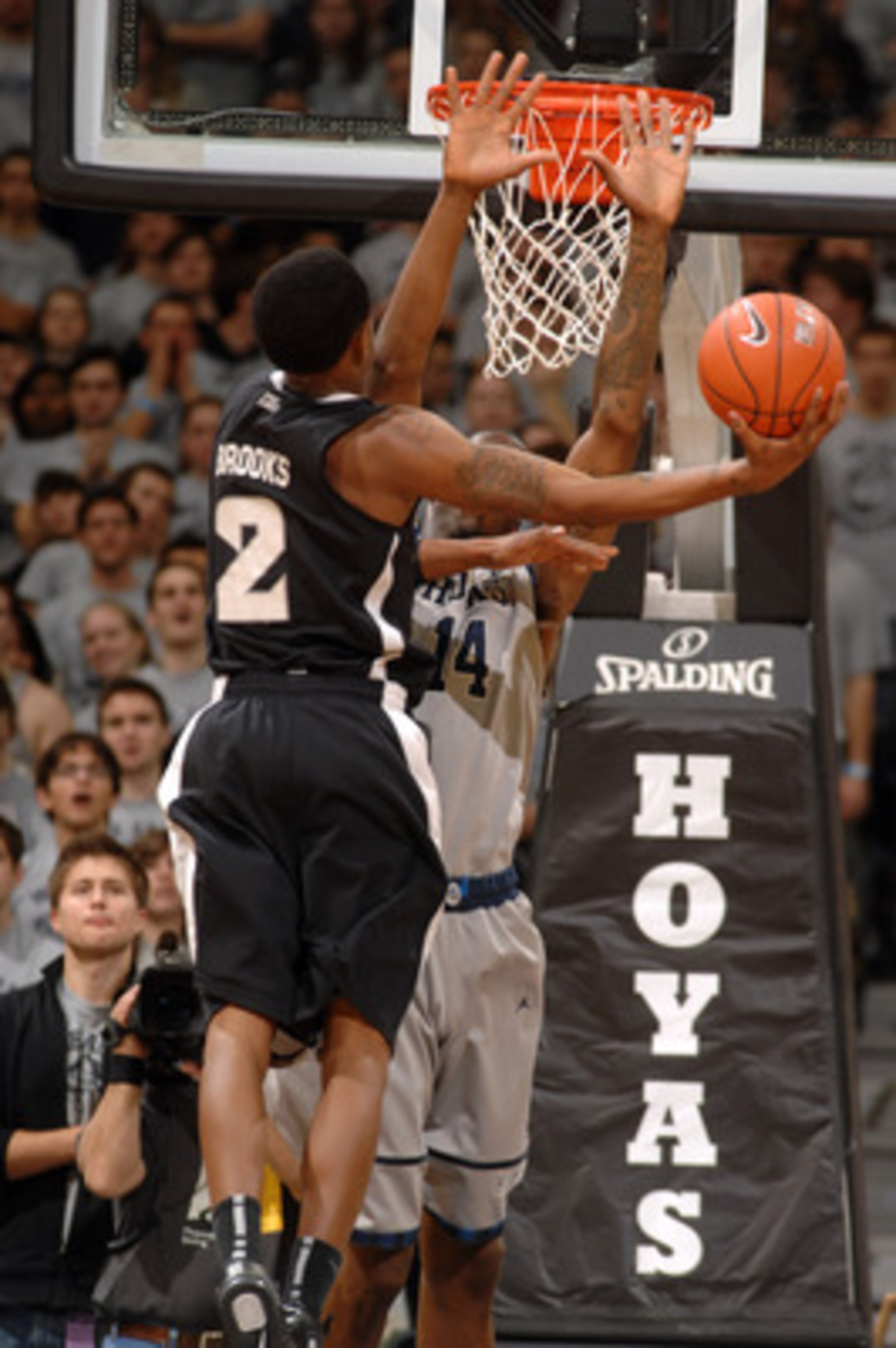 WASHINGTON, DC - FEBRUARY 5: Marshon Brooks #2 of the Providence Friars takes a shot over Henry Sims #14 of the Georgetown Hoyas during a college basketball game on February 5, 2011 at the Verizon Center in Washington, DC. The Hoyas won 83-81. (Photo b WASHINGTON, DC - FEBRUARY 5: Marshon Brooks #2 of the Providence Friars takes a shot over Henry Sims #14 of the Georgetown Hoyas during a college basketball game on February 5, 2011 at the Verizon Center in Washington, DC. The Hoyas won 83-81. (Photo b
