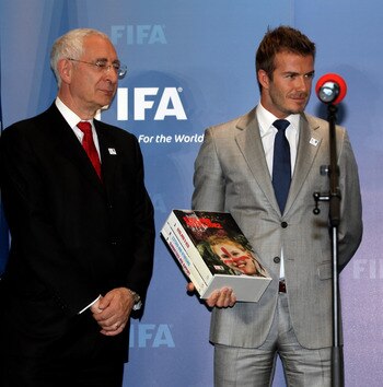 ZURICH, SWITZERLAND - MAY 14: Lord Triesman, Chairman, England 2012 and  David Beckham, England 2018 Vice President prepare to hand over the Bid book to Sepp Blatter, President of FIFA during the 2018/2022 World Cup Bid Book Handover ceremony at FIFA Head