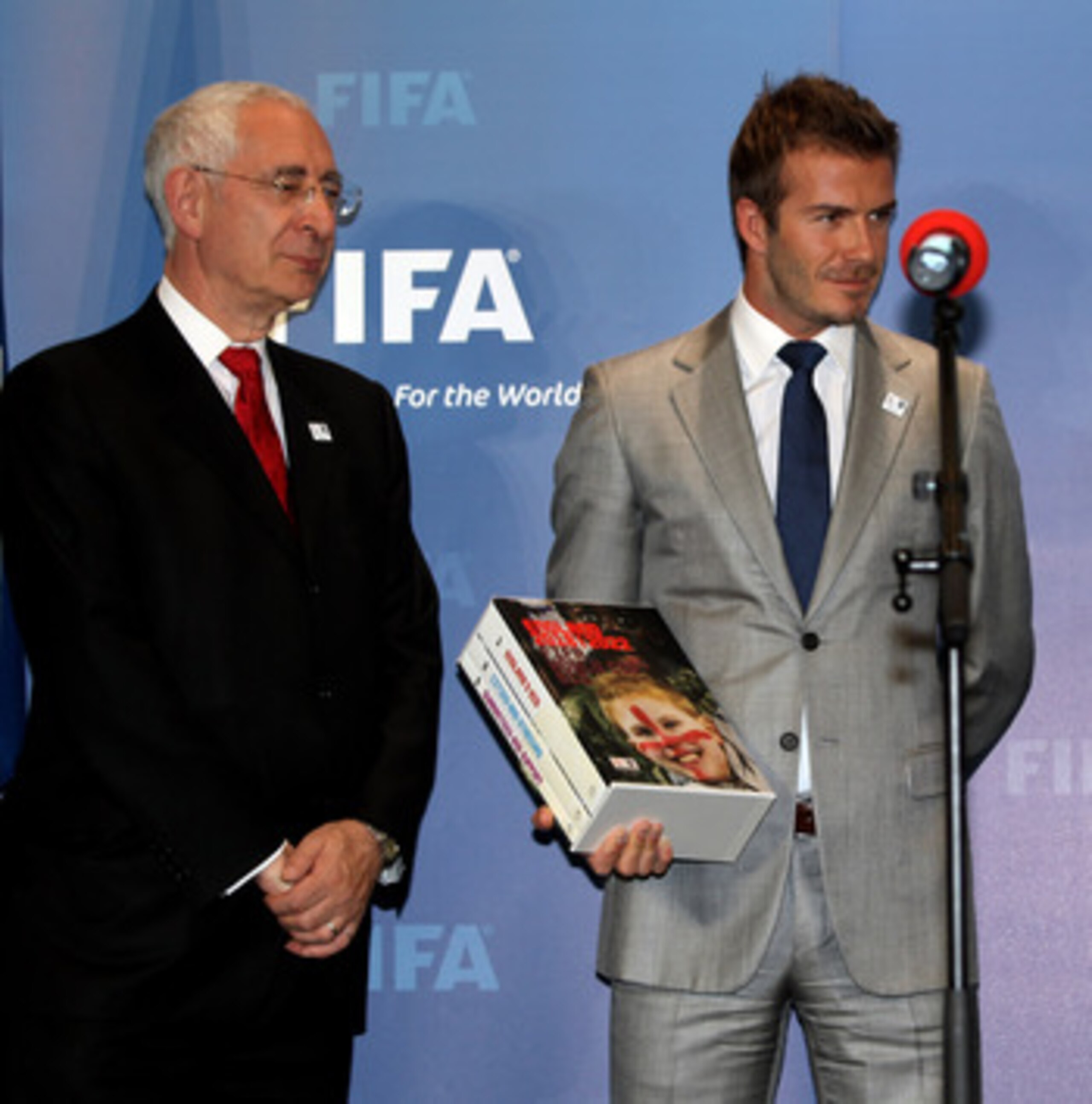 ZURICH, SWITZERLAND - MAY 14: Lord Triesman, Chairman, England 2012 and  David Beckham, England 2018 Vice President prepare to hand over the Bid book to Sepp Blatter, President of FIFA during the 2018/2022 World Cup Bid Book Handover ceremony at FIFA Head