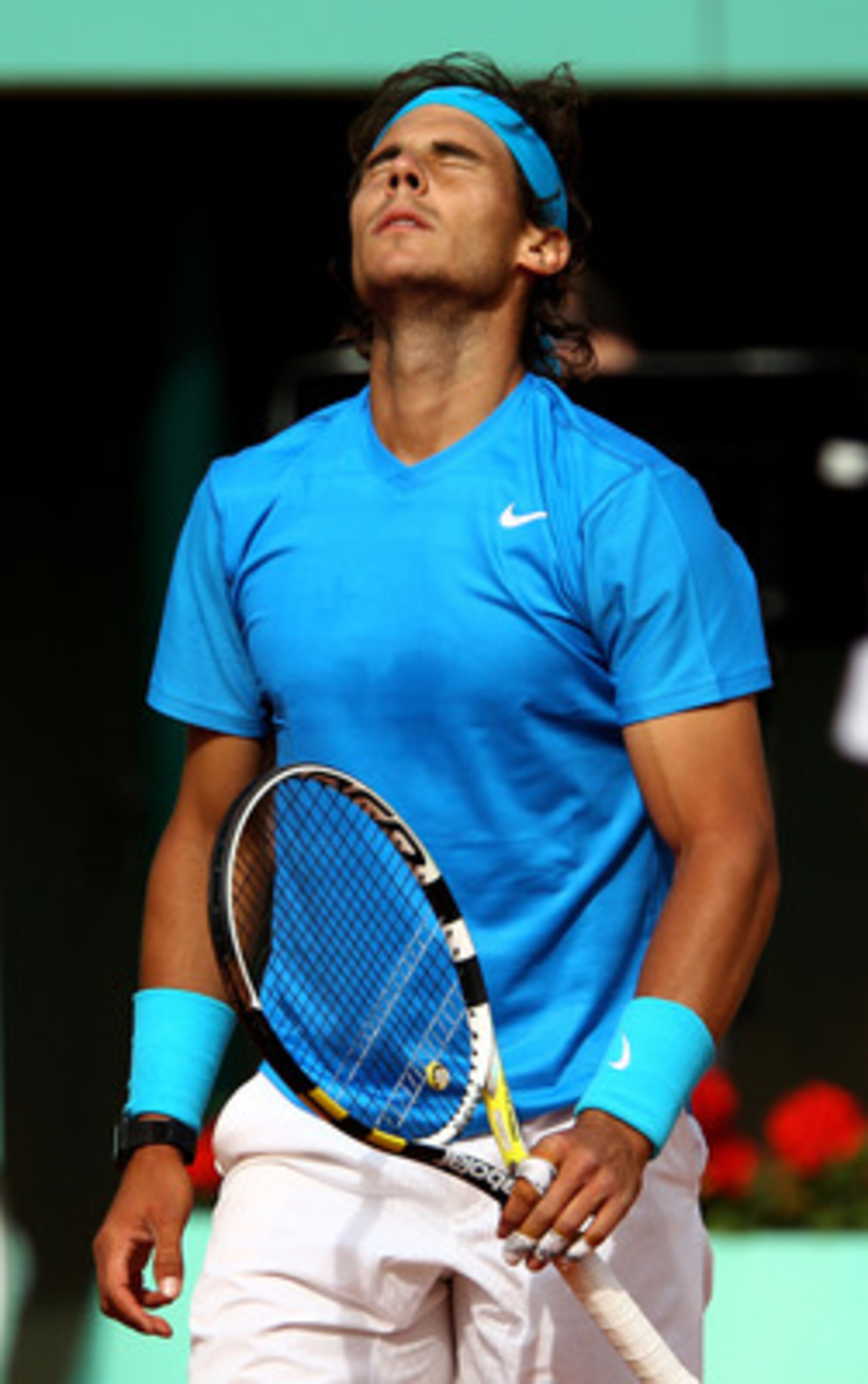 PARIS, FRANCE - MAY 24: Rafael Nadal of Spain shows his dejection during the men's singles round one match between Rafael Nadal of Spain and John Isner of USA on day three of the French Open at Roland Garros on May 24, 2011 in Paris, France. (Photo by C PARIS, FRANCE - MAY 24: Rafael Nadal of Spain shows his dejection during the men's singles round one match between Rafael Nadal of Spain and John Isner of USA on day three of the French Open at Roland Garros on May 24, 2011 in Paris, France. (Photo by C