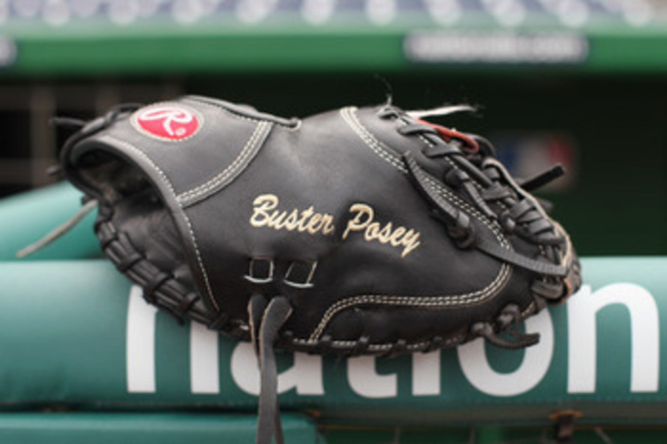 WASHINGTON, DC - APRIL 29: The glove of catcher Buster Posey #28 of the San Francisco Giants rests on the railing in the dugout before the start of the Gaints game against the Washington Nationals at Nationals Park on April 29, 2011 in Washington, DC. ( WASHINGTON, DC - APRIL 29: The glove of catcher Buster Posey #28 of the San Francisco Giants rests on the railing in the dugout before the start of the Gaints game against the Washington Nationals at Nationals Park on April 29, 2011 in Washington, DC. (