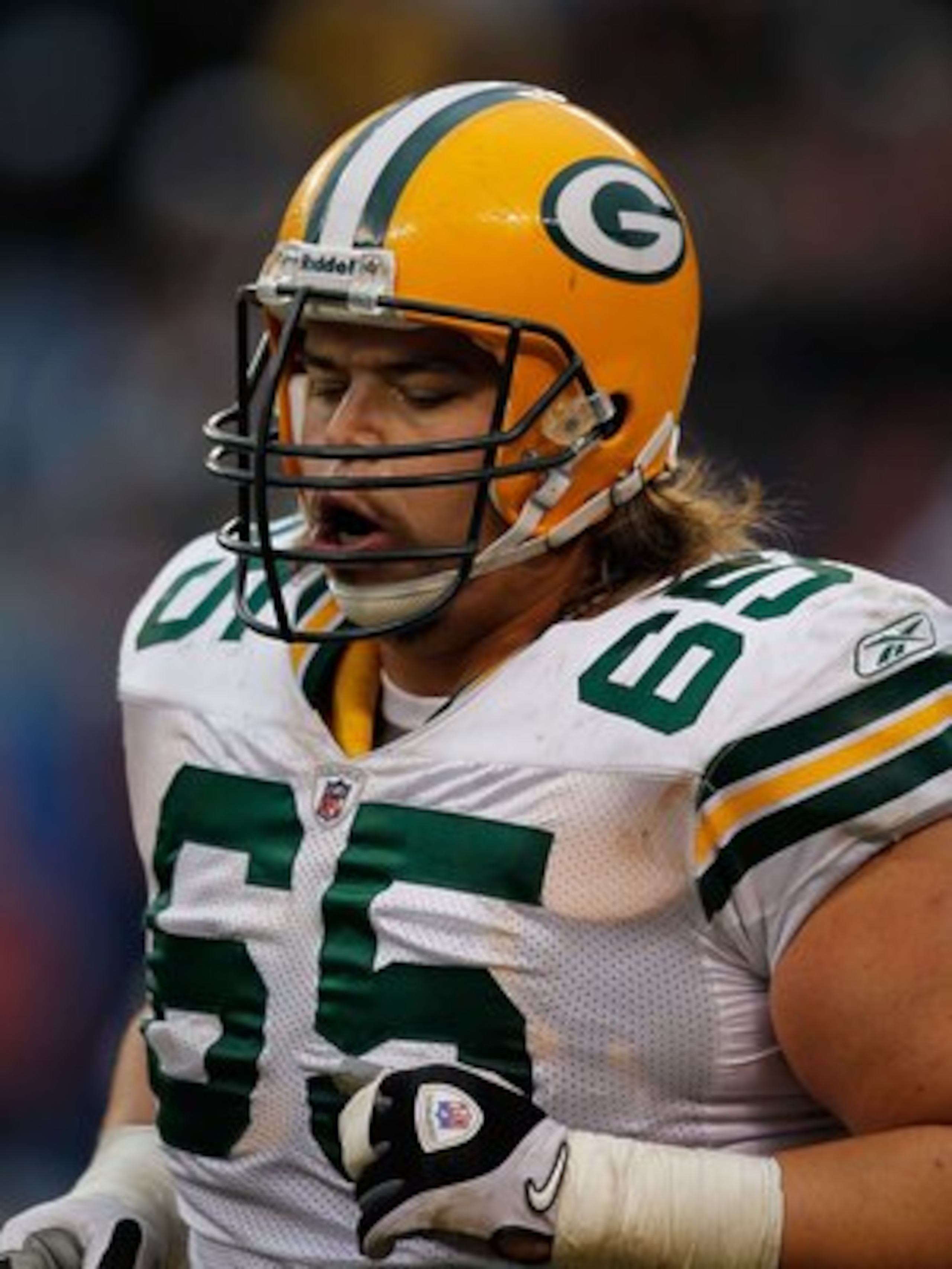 CHICAGO - DECEMBER 13: Mark Tauscher #65 of the Green Bay Packers runs off the field during a game against the Chicago Bears at Soldier Field on December 13, 2009 in Chicago, Illinois. The Packers defeated the Bears 21-14. (Photo by Jonathan Daniel/Getty