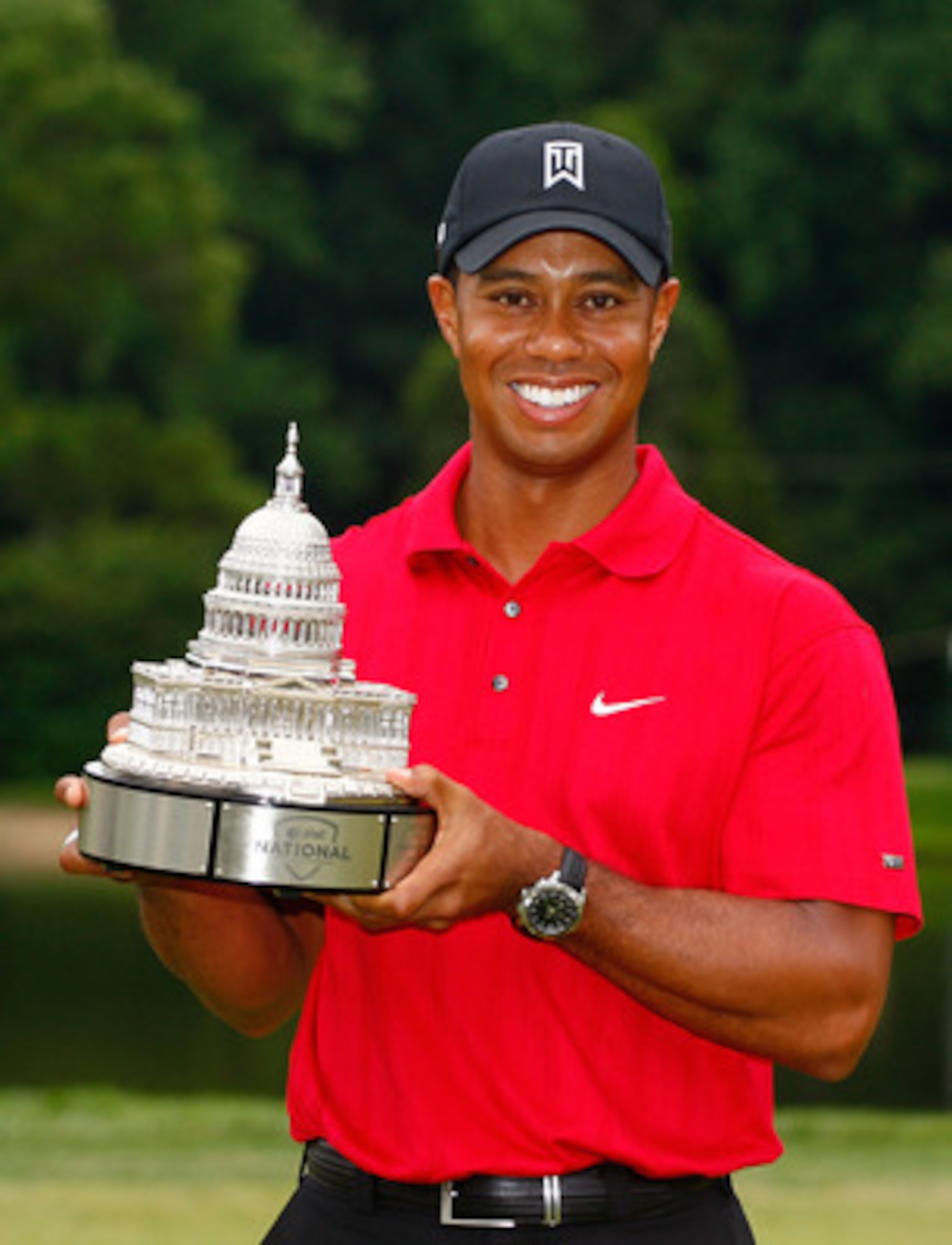 BETHESDA, MD - JULY 05:  Tiger Woods poses with the trophy after his one-stroke victory at the AT&T National at the Congressional Country Club on July 5, 2009 in Bethesda, Maryland.  (Photo by Scott Halleran/Getty Images)