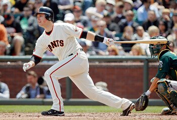 SAN FRANCISCO, CA - MAY 22:  Buster Posey #28 of the San Francisco Giants singles to left field against the Oakland A's  in the third inning at AT&T Park on May 22, 2011 in San Francisco, California.  The Giants won 5-4 in 11 innings.  (Photo by Brian Bah