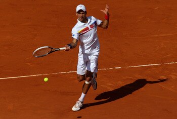 PARIS, FRANCE - MAY 29:  Novak Djokovic of Serbia hits a forehand during the men's singles round four match between Richard Gasquet of France and Novak Djokovic of Serbia on day eight of the French Open at Roland Garros on May 29, 2011 in Paris, France.