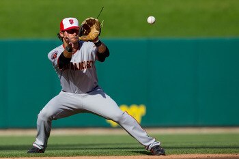 ST. LOUIS, MO - MAY 30:  Brandon Crawford #35 of the San Francisco Giants fields a line drive against the St. Louis Cardinals at Busch Stadium on May 30, 2011 in St. Louis, Missouri.  (Photo by Dilip Vishwanat/Getty Images)