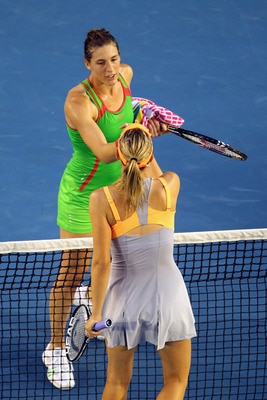 MELBOURNE, AUSTRALIA - JANUARY 23:  Andrea Petkovic of Germany is congratulated by Maria Sharapova of Russia after winning her fourth round match during day seven of the 2011 Australian Open at Melbourne Park on January 23, 2011 in Melbourne, Australia.  