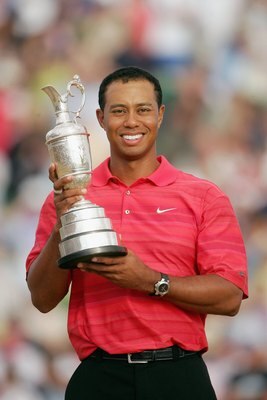 HOYLAKE, UNITED KINGDOM - JULY 23:  Tiger Woods of USA poses with the claret jug following his two shot victory at the end of the final round of The Open Championship at Royal Liverpool Golf Club on July 23, 2006 in Hoylake, England.  (Photo by Andrew Red