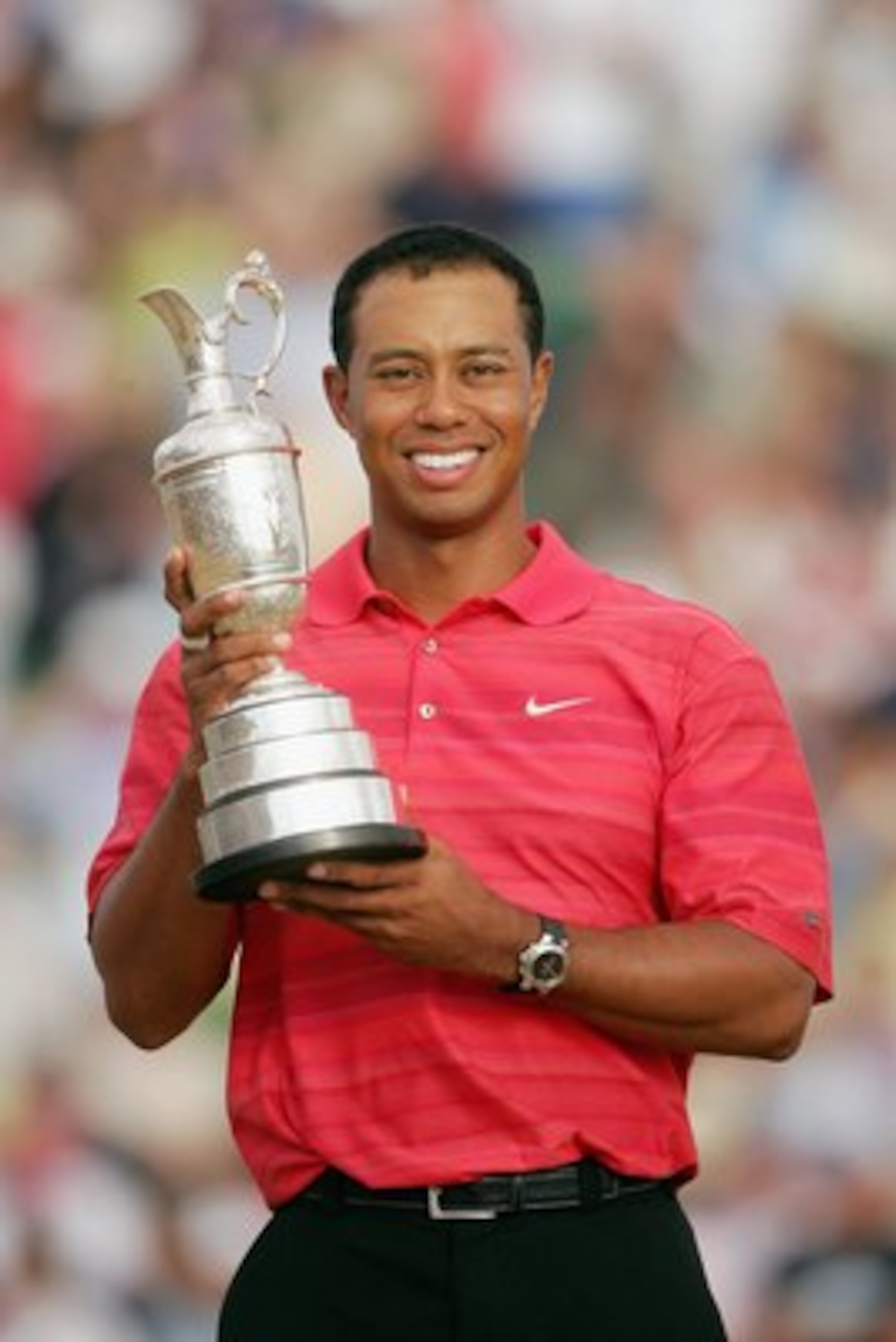 HOYLAKE, UNITED KINGDOM - JULY 23:  Tiger Woods of USA poses with the claret jug following his two shot victory at the end of the final round of The Open Championship at Royal Liverpool Golf Club on July 23, 2006 in Hoylake, England.  (Photo by Andrew Red