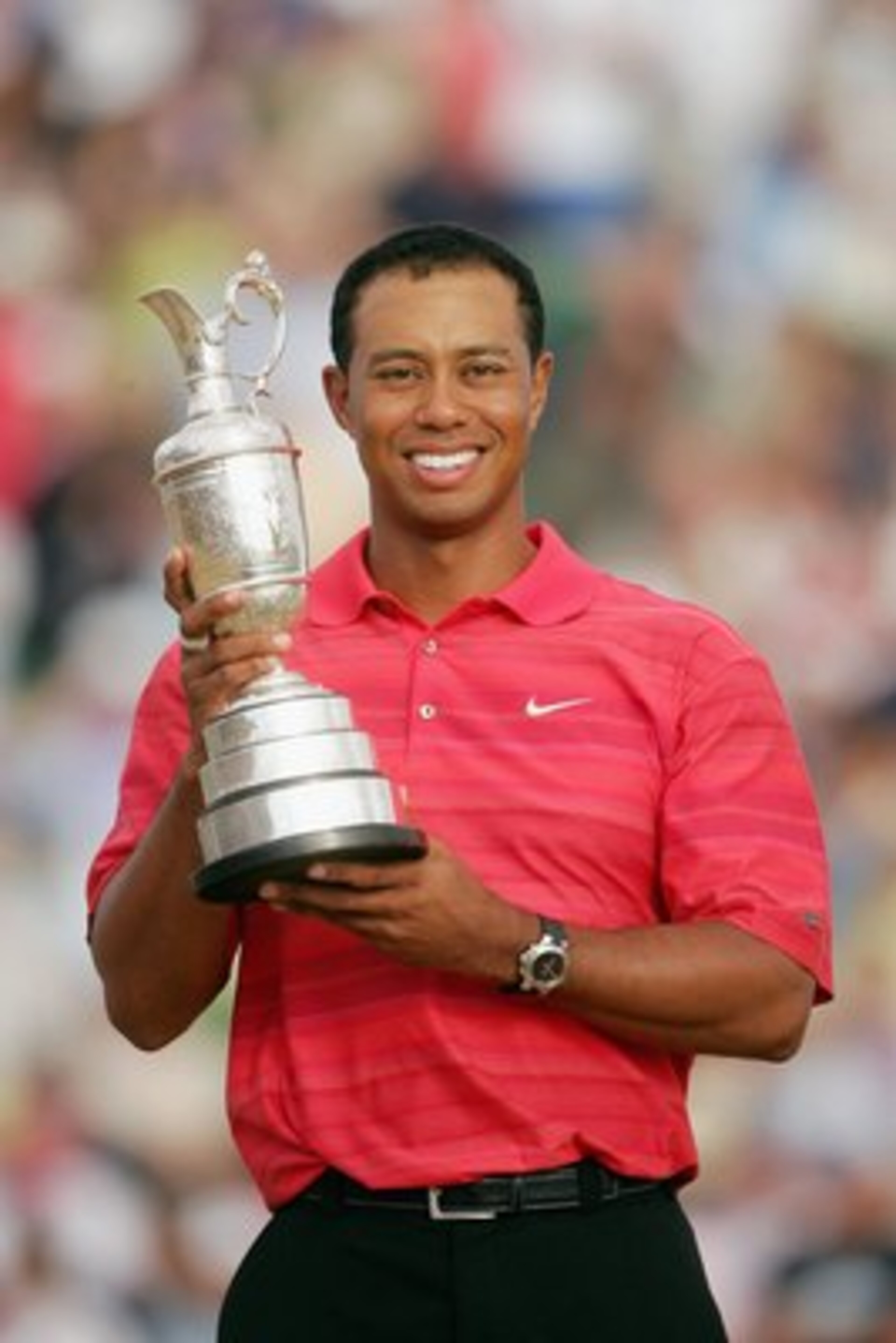 HOYLAKE, UNITED KINGDOM - JULY 23:  Tiger Woods of USA poses with the claret jug following his two shot victory at the end of the final round of The Open Championship at Royal Liverpool Golf Club on July 23, 2006 in Hoylake, England.  (Photo by Andrew Red