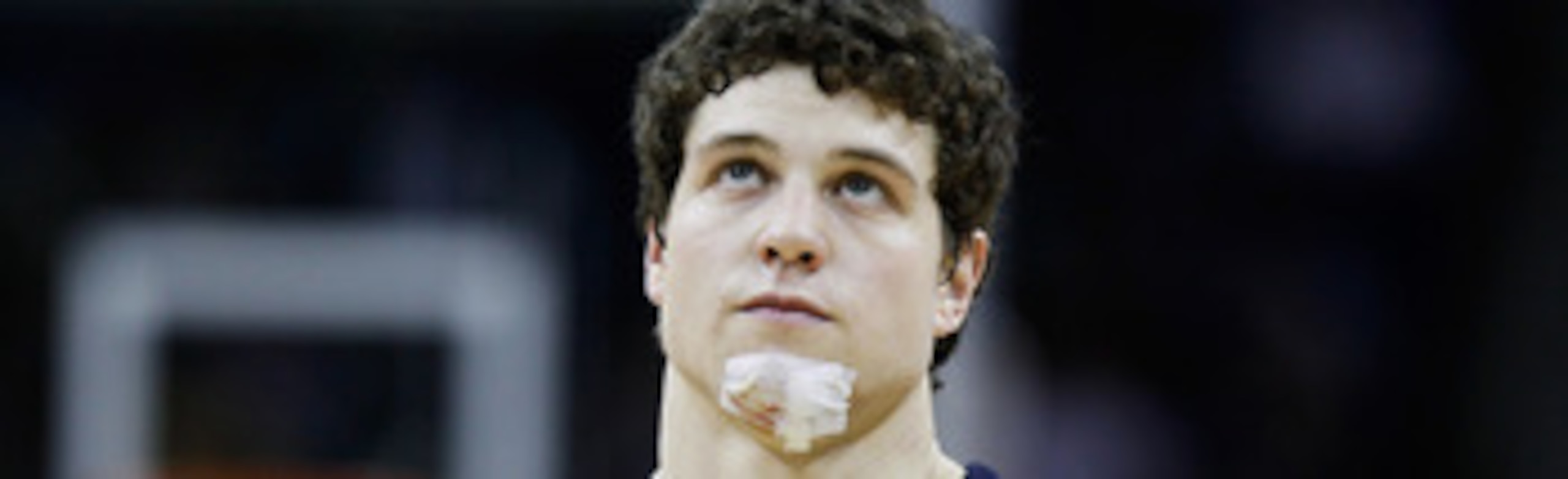 NEW ORLEANS, LA - MARCH 24:  Jimmer Fredette #32 of the Brigham Young Cougars looks on with a bandage on his chin during the second half against the Florida Gators during the Southeast regional of the 2011 NCAA men's basketball tournament at New Orleans A