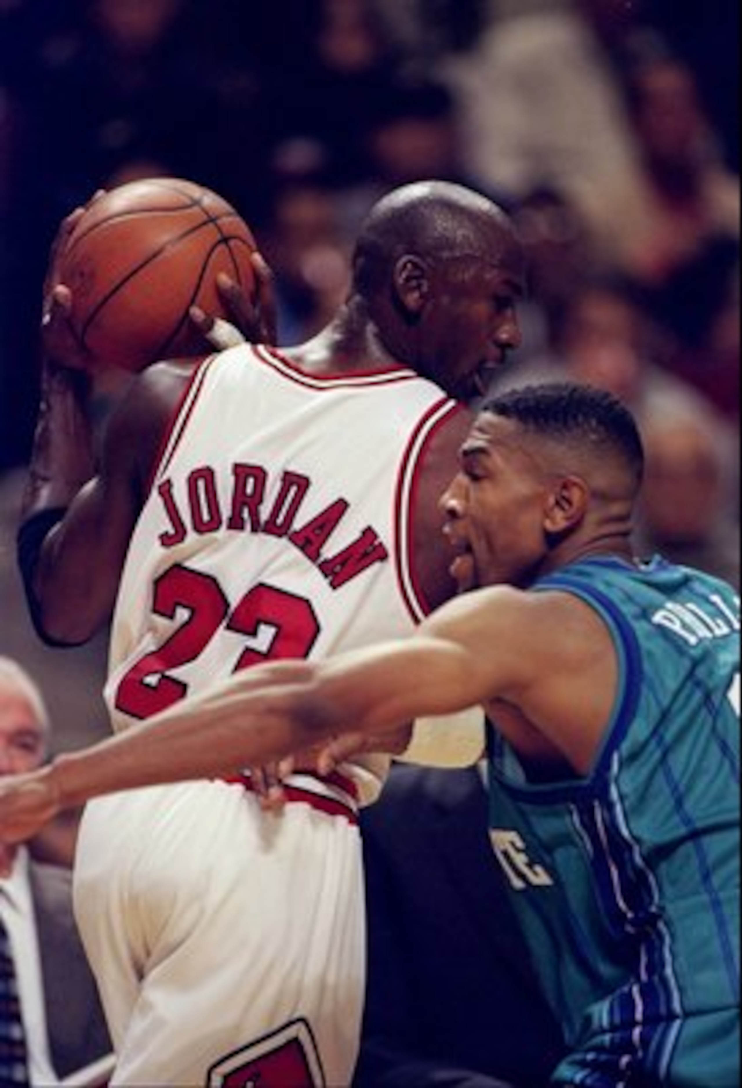 14 Nov 1997:  Guard Michael Jordan of the Chicago Bulls tries to fend off guard Bobby Phills of the Charlotte Hornets during a game at the United Center in Chicago, Illinois.  The Bulls won the game 105-92. Mandatory Credit: Jonathan Daniel  /Allsport