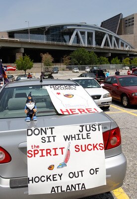 ATLANTA, GA - MAY 21:  A sign displayed outside Philips Arena shows a hockey fan's displeasure in the Atlanta Spirit Group, who owns the Atlanta Thrashers, as fans hold a rally to keep the team in Atlanta at Philips Arena on May 21, 2011 in Atlanta, Georg