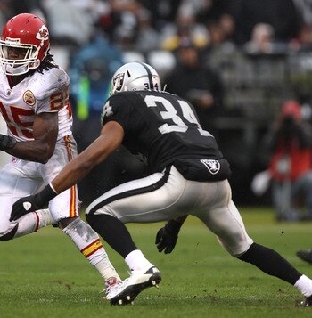 OAKLAND, CA - NOVEMBER 07:  Jamaal Charles #25 of the Kansas City Chiefs runs against Mike Mitchell #34 of the Oakland Raiders during an NFL game at Oakland-Alameda County Coliseum on November 7, 2010 in Oakland, California.  (Photo by Jed Jacobsohn/Getty