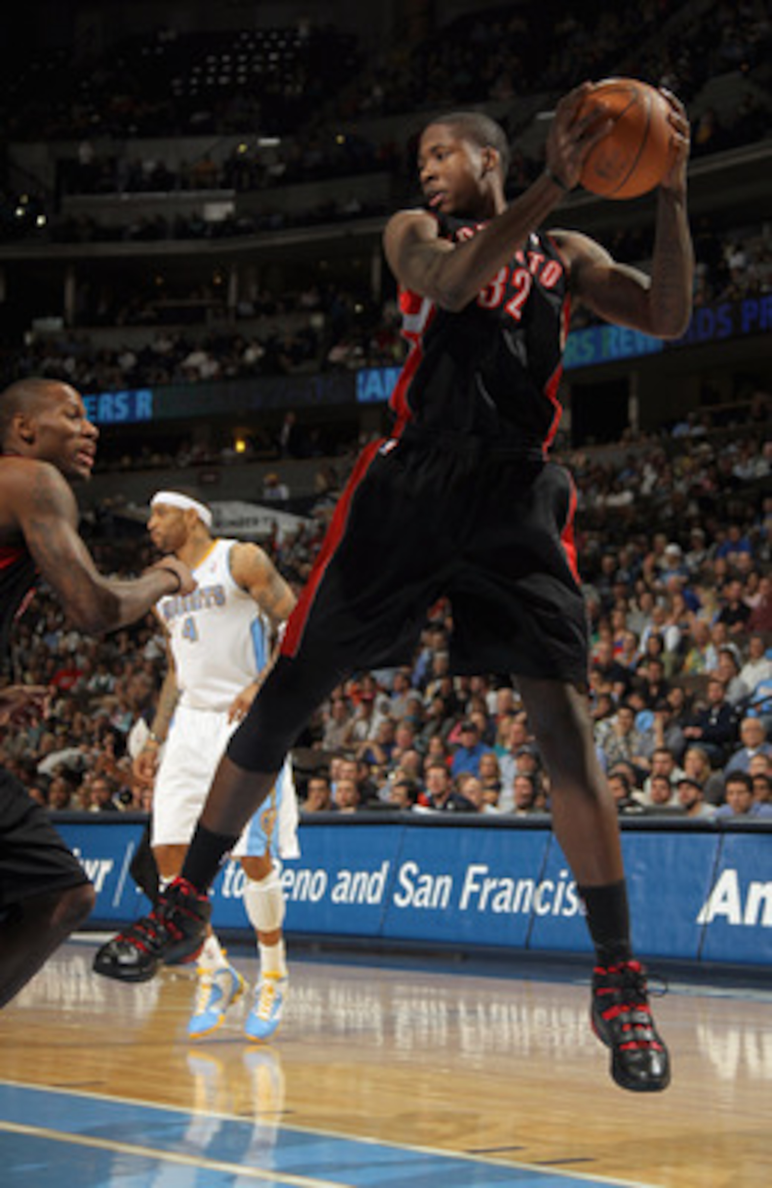 DENVER, CO - MARCH 21:  Ed Davis #32 of the Toronto Raptors grabs a rebound against the Denver Nuggets at the Pepsi Center on March 21, 2011 in Denver, Colorado. The Nuggets defeated the Raptors 123-90. NOTE TO USER: User expressly acknowledges and agrees